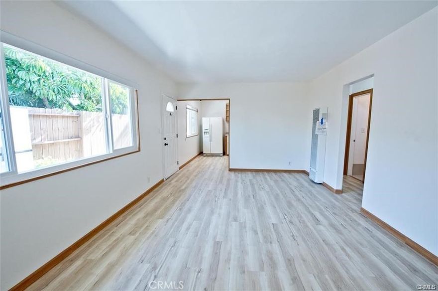 Remodeled two bedroom one bath single level  end unit   No one above or below.. Unit is nicely tucked away in the rear of property.  On site washer/dryer. Water and Trash is included.  Excellent opportunity to live close to the beach in a  renovated unit with no neighbors above or below. Cats ok, no dogs
