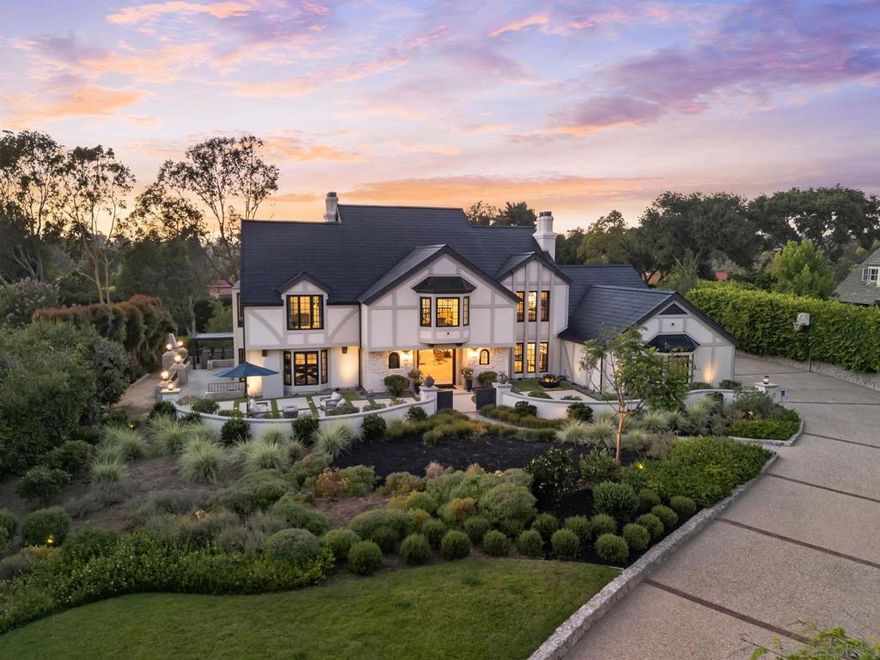 This Impeccable Custom Estate feels more like New Construction and is an Entertainers Dream! Current Sellers just rebuilt all bedroom suite bathrooms and made additional and incredible enhancements, which included adding more outdoor living, enhanced landscape plus adding a jacuzzi to the salt water resort pool. The location is A++ with a full SOLAR Tesla roof, all new doors and windows throughout, custom steel front door, oversized fire pit and 2 large outdoor TVs, great BBQ area, designer kitchen w/top end appliances. The Primary suite is oversized with sep Her & His custom closets that will have any the fussiest happy and the NEW Spa Bath takes luxury to a new level. The office has a separate entrance for those who work from home and the game room is the best place to hang with custom waterfall wet bar with wine storage, champagne area plus ice maker. The property offers a main floor guest wing and there is lots of room to add an ADU "guest home" if desired. The sense of arrival from the street is impressive with a long driveway leading guests up to the walk way.