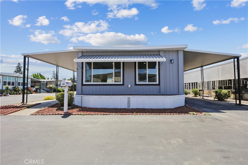 Discover this beautifully designed, modern mobile home crafted for those aged 55+ seeking comfort, elegance, and practicality. This charming residence features two spacious bedrooms and two full bathrooms, offering ample room for relaxation and hosting guests. The open-concept living area boasts a stunning fireplace, adding warmth and sophisticationperfect for cozy evenings or entertaining. The kitchen and dining areas offer sleek finishes and generous storage, combining style with everyday convenience. A versatile loft adds flexibility for an extra bedroom, office, or hobby space. Thoughtfully laid out to maximize natural light, the home feels open, airy, and welcoming. Premium touches like elegant fixtures and contemporary finishes lend a high-end feel, while the smart design supports active, modern living. Whether you're downsizing or looking for a peaceful retreat, this home blends beauty, functionality, and comfortan ideal choice for 55+ communities and discerning buyers alike.