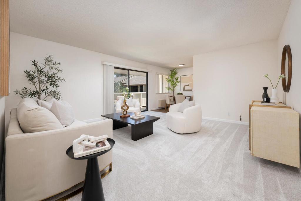 Affordable, Updated & Roomy. Welcome to this bright & beautifully updated second-floor condo in Santa Clara's highly desirable Woodsborough community. With generous living space & thoughtful upgrades, this home offers easy, low-maintenance living in an unbeatable location. Step into a spacious living room filled with natural light, featuring a sliding glass door that opens onto a charming private balcony perfect for morning coffee or evening relaxation. Stay comfortable year-round with electric heating and wall A/C. Remodeled kitchen features sleek stainless steel appliances, fresh kitchen flooring, new carpet and paint throughout. The partially updated bathroom gives fresh, move-in-ready appeal. Enjoy the convenience of an assigned carport directly below the unit with extra storage included. Say goodbye to yard work and enjoy beautifully maintained community grounds, with shade trees, meandering paths, and tranquil ponds. Community amenities include: Pool, Hot tub & spa, Clubhouse. Prime location minutes from Santa Clara Central Park, Kaiser Hospital, Target, Sprouts, Costco, coffee & dining options. Easy access to Lawrence & San Tomas Expressways, El Camino Real, & Hwy 280, close to Apple, Nvidia, & other major tech campuses, no freeway required! Say "Hello" to a good buy!