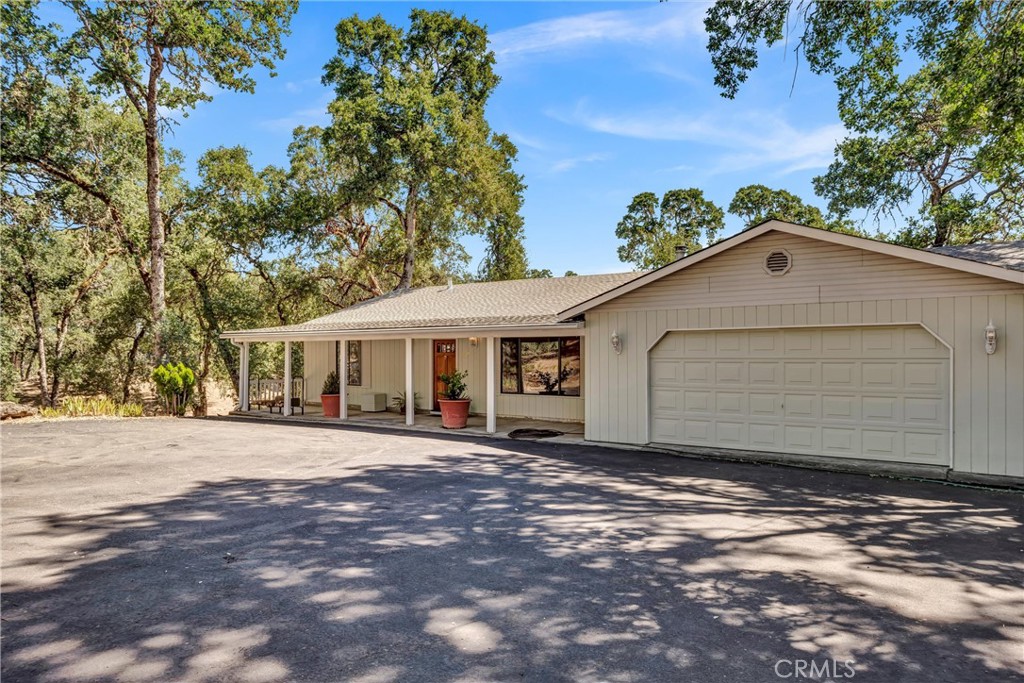 Oak-Studded Retreat on Private Road and 2.39 Acres in Lakeport ~
Welcome to your own peaceful escape nestled in one of Lakeport’s most desirable areas—just minutes from town yet offering the space, privacy, and beauty of country living. This 3 bedroom, 2.5 bath home spans 2,682 sq ft and sits on a fully fenced and gated 2.39-acre parcel adorned with majestic oak trees.
Take in the serene views from the expansive redwood deck, partially covered for year-round enjoyment, perfect for outdoor dining, entertaining, or simply relaxing in nature.
Inside, the home features fresh interior and exterior paint, vinyl plank flooring in the living room, tile in the kitchen and baths, and carpeted bedrooms for comfort. The main level offers a spacious living room with a cozy Vermont Castings wood stove, a bright kitchen with adjacent dining area, two bedrooms, a full bath, and a convenient half bath off the garage.
Downstairs, discover a large family room, additional bedroom, full bathroom, and a laundry room—ideal for multi-generational living, guests, or a private retreat. The Softub hot tub is included—ready for you to soak under the stars. And ample under-house storage
Enjoy a Trane brand heat pump for central heat and air conditioning, a whole house fan, and a reliable well water system with 2,500-gallon above-ground storage tank. The attached 2-car garage features a bonus hobby room with a door leading to the deck, and still provides room to park two cars—perfect for a home office, art studio, or workout space.
This unique property combines functionality, privacy, and natural beauty—ready for you to move in and make it your own.