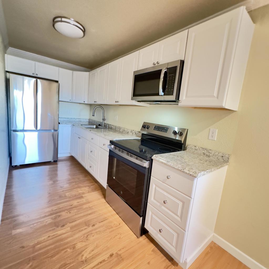 Step inside this lovely remodeled top floor condo to find an open floor plan with a bonus window from being on the corner end unit. The elegant crown molding, laminate wood flooring, brand new installed kitchen with sparkling new appliances give the condo additional appeal. Additional upgrades include newer windows/sliding glass door, recessed lighting, updated walk in shower and vanity. There is a private covered balcony that you can access from the great room and sip your morning coffee while enjoying the view of Mount San Jacinto. There is ample covered carport parking nearby. The closest pool is in front of building J and there is a single jacuzzi on the other side. This gated community is within close proximity to down town Palm Springs. The San Jacinto National Park and tram are across HWY 111, with easy access for all of the nature lovers. Just a short drive to Interstate !0 freeway giving you. easy access to all the Coachella Valley has to offer. Amenities include tennis courts, swimming pools, jacuzzi's and lovely green belts throughout.