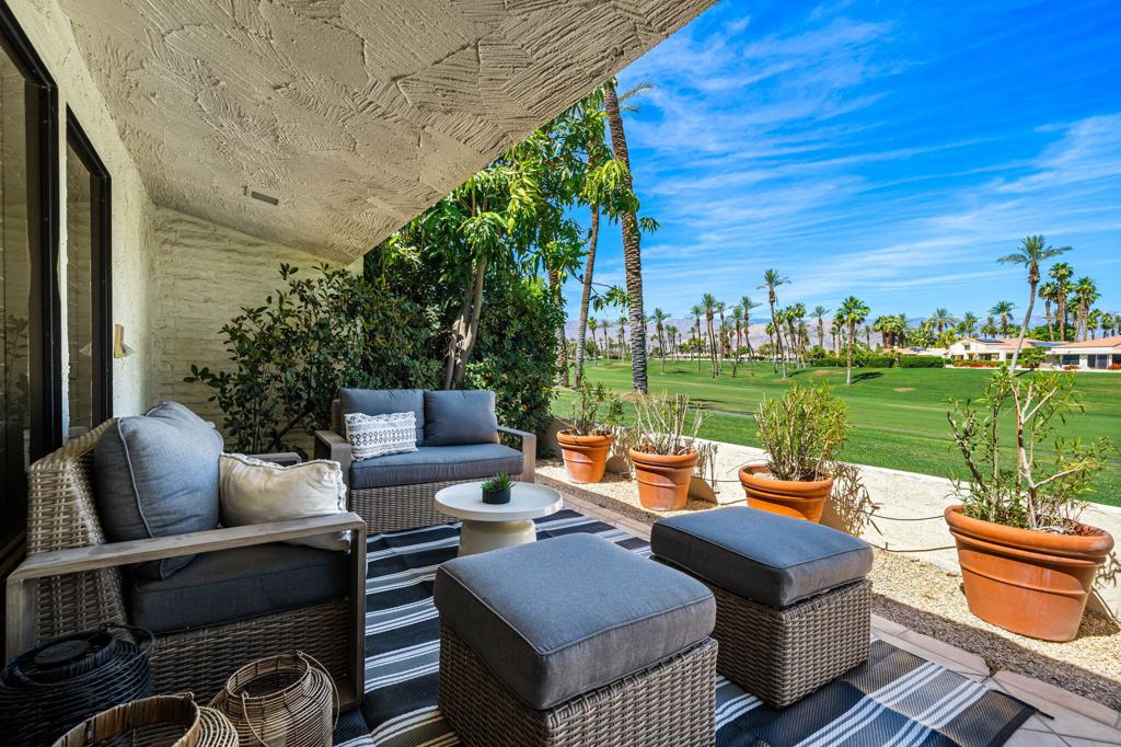 BE INSPIRED. Tucked away behind the gates of prestigious Desert Horizons Country Club, this residence offers timeless elegance, modern updates, and serene desert living in the heart of Indian Wells. An elegant double-door entry welcomes you into this beautifully maintained 3bd/3ba home. Inside you will notice oversized skylights filling the space with natural light.The open-concept living room is anchored by a charming stone fireplace framed by built-in bookcases. The west-facing views of the 1st fairway of the private golf course and San Jacinto Mountains create a breathtaking daily backdrop.An updated kitchen features warm-toned cabinetry, quartz countertops, a custom backsplash, and a built-in refrigerator designed for both function and style. Retreat to the spacious primary suite with a spa-inspired bath and steam shower. The guest bedrooms are thoughtfully separated offering comfort and privacy. The gated east facing front courtyard adds charm and privacy and a perfect retreat for your morning coffee or a quiet afternoon with your favorite book.And just to add a giant cherry on this delicious cake, there is a brand-new HVAC system (2025). Make memories and new friendships at the spectacular desert-modern clubhouse which includes an innovative restaurant and bar, 8,000 sq ft wellness center, pro shop, and courts pavilion with 11 pickleball and 2 tennis courts. Whether you're seeking a private escape, a place to connect with family, or full-time retreat this home delivers harmony, sophistication, and the essence of luxury desert lifestyle. Call for your private showing today.