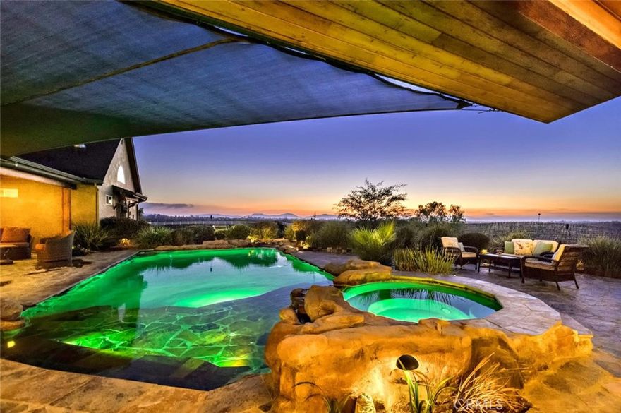 One-of-a-Kind Luxury Estate & Horse Ranch in Temecula Wine Country.

Welcome to the most amazing & truly special property in all of Temecula Wine Country—an exceptional estate set on over 7+ pristine acres, backing to miles of vineyards. 3 private homes, premier equestrian facilities, & resort-style amenities, this estate is a rare gem. Whether you're planning a luxurious retreat, establishing a multi-generational family compound, or looking for an income-producing vacation rental, this property offers it all.

Estate Highlights: Multiple Homes for ultimate flexibility & privacy.

Impeccably landscaped grounds w/resort-style lagoon pool & spa, panoramic vineyard views, & many entertaining spaces.

Top-tier horse facilities including a lighted riding arena. Expansive 225’ x 125’ with lights & speakers, perfect for training and events, viewing pavilion, 15 Horse Mare Motel: Open-air stalls of varying sizes w/a minimum of 18’ x 20’+, 60' round pen, wash racks & tack room.

Located just minutes from Temecula’s world-renowned wineries, shopping & freeway access.

The Main Residence: Tuscan-inspired & beautifully appointed with 4 bdrm's, 2 luxurious master suites w/spa-style baths & walk-in closets. Open-concept living w/retractable bi-fold patio doors for true indoor-outdoor living.

Chef’s kitchen w/Viking stainless appliances, custom wood cabinetry, 8’ butcher block island, & leathered granite countertops. Walk-in pantry w/built-in wine cooler. Natural stone floors & custom ambient lighting thru out.

The Villas: Nestled in the heart of the estate, the Villas feature a rustic inn ambiance w/stunning stonework & scenic views of gentle hills. Each villa offers: 4 private suites w/a shared lobby space. Each villa offers a King bed, electric fireplaces, smart TVs, mini-refrigerators & coffee/espresso machines. Bathrooms w/large stone showers, dual sinks, & separate water closets.

The Cottage is darling includes: 2 bdrm's & 2 baths, Full kitchen & cozy living area. Indoor & outdoor dining spaces perfect for relaxing or entertaining. Decorated w/upscale rustic ranch flair & equipped with every amenity for a pampered, unplugged experience. So Many Possibilities. Perfect for multi-family stays, destination events, equestrian vacations, or a dream home with income potential. This estate is more than a property—it’s a lifestyle destination. Truly a magical property & is turnkey.  This is a must see!!