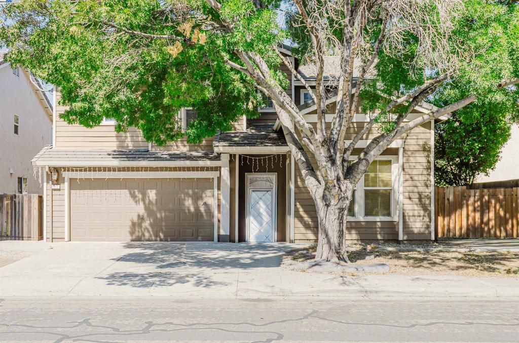 Welcome to this gorgeous multi-generational family home! This beauty features 3 bedrooms + 2.5 bath with an additional bonus bedroom downstairs and a converted loft room upstairs! With 2135 sq ft of living space in the sought-after Ryland Junction neighborhood, enjoy vaulted ceilings, laminated flooring, separated family room and a cozy living room with a wood burning fireplace. The updated kitchen features granite countertops and stainless-steel appliances. This home has a low-maintenance backyard with a covered patio, ideal for relaxing or entertaining. With a 2-car garage, tile roof, and great location near parks, schools, and shops, this home is move-in ready waiting to be yours! This home is equipped with 21 leased solar panels.