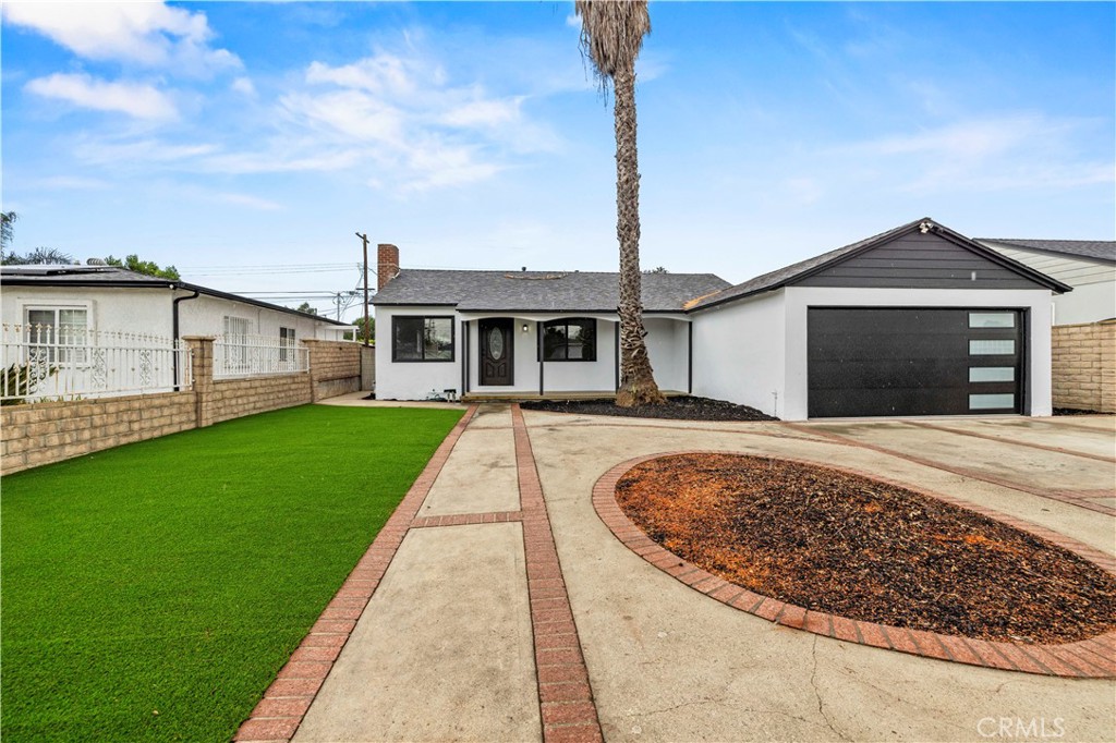 Impeccably renewed, this 3-bedrooom, 2-bath residence blends modern style with everyday comfort on a generous 6,032 sq ft lot. The light-filled interior showcases a designer kitchen with custom white oak cabinetry and new stainless appliances, complemented by beautifully remodeled baths and wide-plank flooring. Thoughtful upgrades include a new roof, windows, HVAC, plumbing, electrical, and garage door. Beyond the interiors, a gated with fresh turf and landscaping creates a private retreat for relaxation or entertaining. A rare turnkey offering where every detail has been carefully considered.