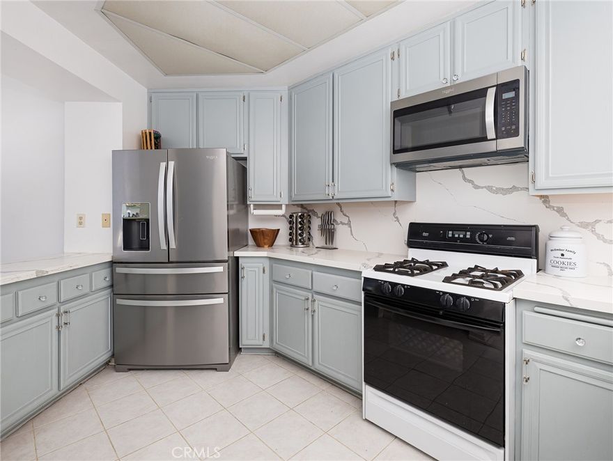 Picturesque condo that nestled at the end of a cul-de-sac in coastal San Pedro. 







The serene community has a private gated parking and is built around a treelined area of the city. Oak colored floors adorn the entrance to this lovely condo which are complimented by pure white colors walls that continue to rise up to impressive vaults that can be enjoyed in the dining room and again in the large family room. The airy expanse invites tremendous light to pour in the volumed space organically. The entire structure is protected by a woodland area that welcomes local bird life, which gently fills the home with pleasant singing, a testament to this homes peaceful nature. 

A large balcony breathes in views of the port, Palos Verdes hillside, local soccer fields, and encompassing greenery. The dining room has such an open feel that leads right into the updated kitchen that is customized with quartz counters, backsplash, and touches of a beautiful teal hue on all cabinetry that create a welcoming ambiance for friends & family to enjoy home cooked meals. 



A secondary server off the kitchen is complete with a sink and additional cabinetry plus mirrors which is a huge asset during culinary experiences at home.



A wonderful bedroom overlooks lush plant life plus walkway and tons of sunlight at the from the home. There is a laundry room inside of the home and this condo happens to be one of the biggest this complex offers. The family room has an attached sitting room that has sweeping views and a cascading staircase that lifts up to an amazing loft. The loft can be left to the imagination of the owners to be a den, hangout, kids playroom, or boardgames area. 



Luckily, the complex is positioned to be walking distance to theaters, restaurants, shopping, and a short distance to freeway access. The gated garage comes with 2 spaces. There is an elevator that goes from the private parking up to the top floor. 



The primary room is an incredible secluded sanctuary. The vaults in this area add another layer of gratitude to the living space which mark an incredible difference to be on the top floor. There’s a lovely his and her closet and his and her sinks side by side that complete this part of the home.