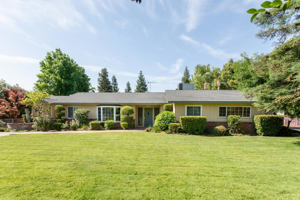 If ONLINE it's available! Open House SUN 12-2pm 8/10/25. This lovely custom 4BD/2BA North Clovis home is within walking distance of top-rated schools, shopping, Parks & festive Candy Cane Lane during the holiday season. Nestled behind mature landscaping, it offers privacy from the front street, & towering trees lining the backyard for a serene retreat. Traditional meets charm, this property is sure to impress with custom built-in cabinets, skylights, Dining room, beveled glass in the foyer, large sun-lit windows, tray ceilings & a bonus room. The kitchen features a nook, bar eating area, gorgeous granite countertops, electric cook-top, stainless-steel appliances & dishwasher. Retire to the Primary Suite & step through a stunning double-arched entry framed with custom crown molding. Inside, a spacious walk-in closet & elegant French doors open to a private patio ideal for quiet mornings w/coffee. The spa-inspired primary bathroom offers a luxurious jetted soaking tub, dual sinks, & walk-in shower designed for relaxation. Hall bathroom has been remodeled. Enjoy the backyard oasis in the sparking pool & spa - perfect for the hot summer months! Don't miss the opportunity of owning this beautiful home!