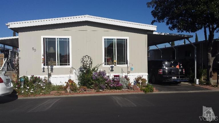Nice 2 bedroom, 2 bath mobile home in a desirable senior community with mountain views. This unit has handicap access with a wheelchair ramp and great walk-in bathtub in the 2nd bath. Dual pane windows & freshly clean carpet. Washer, dryer & refrigerator included in sale. This community has low rents and many amenities & activities. Don't miss this one.