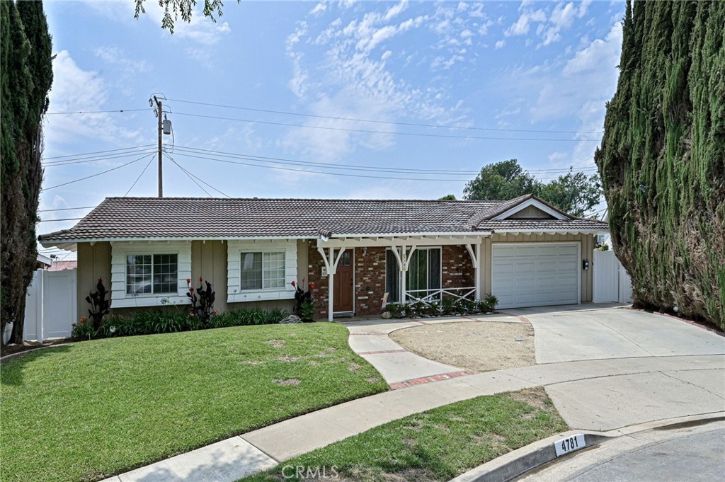 Updated Single-Family Yorba Linda Home with Brand New Permitted ADU – 4 Beds, 3 Baths, 2,560 Sq Ft of Versatile Living Space! Discover the perfect blend of comfort, style, and flexibility in this beautifully updated home, which includes a brand new, fully permitted attached ADU. Located on a quiet cul-de-sac, this home offers thoughtfully designed living space—ideal for multigenerational living, guest accommodations, or rental income. The main home features 3 spacious bedrooms and 2 full bathrooms across 1,811 sq ft, with a bright and functional layout. The remodeled kitchen (completed just 3 years ago) offers a modern feel with white quartz countertops, stainless steel appliances (including a gas cooktop with range hood, microwave, and dishwasher), a large kitchen sink, and a charming garden window. Bathrooms are finished with stylish tile and designer touches for a fresh, contemporary look. Interior highlights include: luxury vinyl plank flooring in common areas, tile flooring in key living spaces, carpeted bedrooms, Double-pane windows throughout, laundry room, & Attached 2-car garage. The newly built 748 sq ft attached ADU adds incredible value with its own private entrance, patio, and grassy yard. It features a spacious bedroom area, full bathroom, and a modern kitchen with quartz countertops, stainless steel gas range, microwave, and a stacked full-size washer & dryer duo. Comfort is ensured with a split AC unit and tankless water heater—all in a private, self-contained space perfect for extended family or income generation. Don’t miss this rare opportunity to own a move-in ready home with built-in versatility and modern upgrades in a desirable cul-de-sac location. Great shopping, restaurants, schools, and parks are nearby.