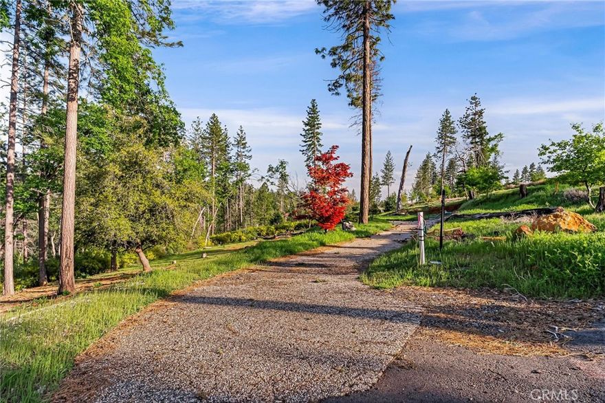 PRIVATE & END OF LANE SETTING for this .75-acre LOT IN THE HEART OF PARADISE!! PID WATER IS STILL ACTIVE and PG&E has natural gas & electric all underground now and waiting at the front of the property for connecting to your new home. This property offers a lovely, treed view as well as well as some existing decorative landscape pieces and the driveway still in place. This location is ideal for its serenity, yet only 2.5 miles to town amenities like shopping, dining and the post office. It also provides a quick access to Skyway and only 12 miles to Hwy 99 in Chico for such an amazingly easy commute with all the benefits of living in a small-town community! This location is also just minutes to Lake Oroville Marina with great fishing, boating, skiing, swimming & amazing year-round water recreation options! Plus, a short drive to Paradise Lake, DeSabla Lake or the Feather River for additional outdoor recreation like fishing, hiking & gold panning!