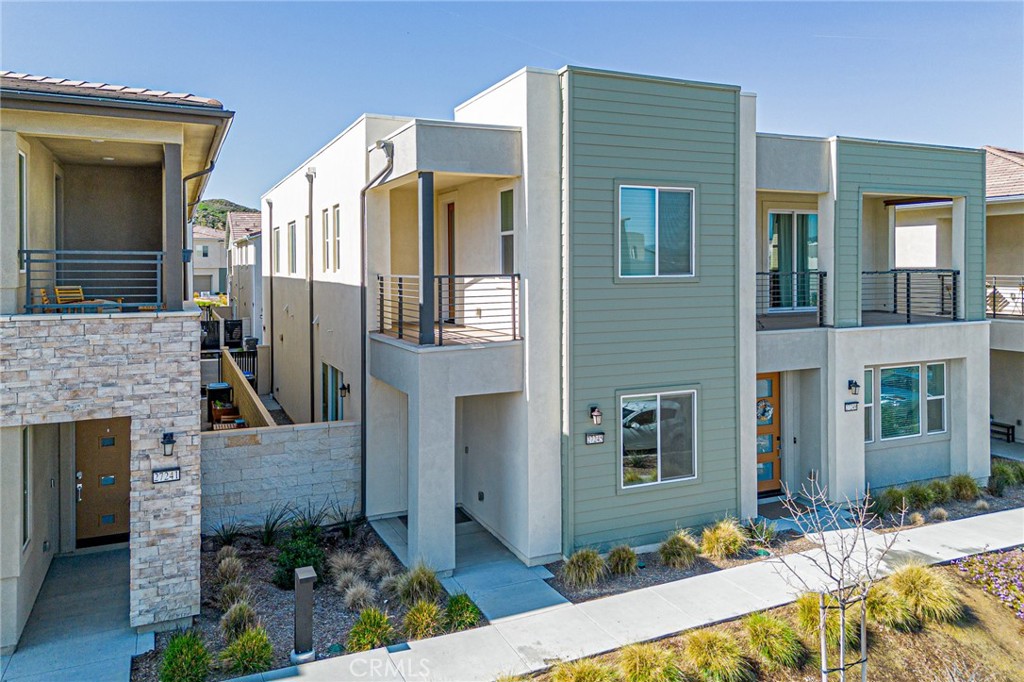 FULLY OWNED SOLAR and Upgraded floor throughout. Stunning Contemporary Home in the Coveted FivePoint Community of Valencia Welcome to this beautifully
upgraded home, ideally situated in the highly sought-after Valencia area. Nestled within the newly developed community, this residence offers the perfect balance
of privacy and convenience—just moments from premier shopping centers and restaurants, yet peacefully tucked away from the city's hustle and bustle. This twostory gem features 3 spacious bedrooms and 2.5 elegantly designed bathrooms, highlighted by an open-concept floor plan bathed in natural light. Soaring ceilings
and expansive windows enhance the airy ambiance, while the light wood-like vinyl plank flooring brings warmth and sophistication throughout the home. The
gourmet kitchen is a chef’s dream, showcasing white shaker cabinets, Quartz countertops, a large center island, an undermount stainless steel sink, and premium
stainless-steel appliances—including a refrigerator. A generous walk-in pantry provides ample storage for all your culinary essentials. Upstairs, the luxurious
primary suite offers a serene retreat complete with a private balcony, walk-in closet, and a highly upgraded bathroom featuring quartz countertops with dual sinks
and a sleek, white tile-wrapped shower stall. The additional bedrooms also include walk-in closets and stylish vinyl plank floors, ensuring comfort and functionality
for family or guests. Additional features include a large Loft for entertainment or study, spacious laundry room, a peaceful side yard perfect for outdoor relaxation,
and an extended two-car garage with direct access and pre-wiring for an EV charger. And fully paid-off solar panels. Enjoy resort-style living with access to
exclusive community amenities including a sparkling pool, spa, clubhouse, picnic areas, playgrounds, and more. This turnkey home offers the best of modern living
in one of Valencia’s most desirable neighborhoods. Don’t miss your opportunity to make it yours!