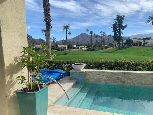 Beautiful southern views from Spyglass home located in Desert Horizons CC. This home boasts 3 bedroom suites with 3 batths plus a powder room; Spacious and light with magnificient views of the 11th fairway and golf course. Each bedroom has a garden view. The lovely patio includes an inviting pool with added spool and beautiful seating. Kitchen has been totally remodeled. The home includes a large family room with bar plus a living room and dining room. One parking space in the garage.