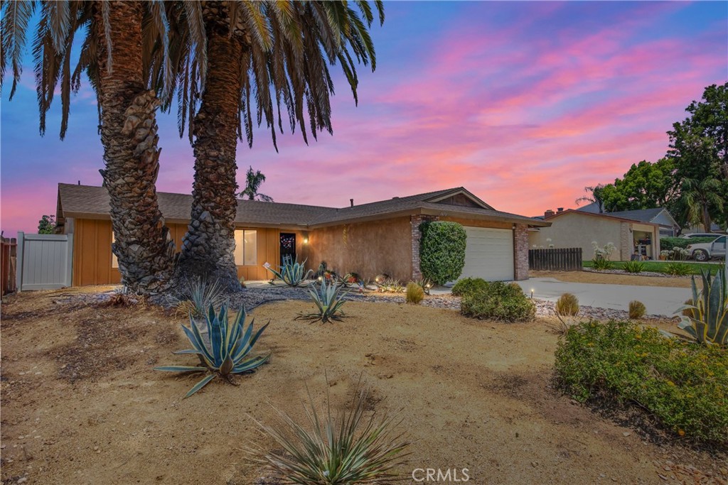 Welcome to your ideal family home! This inviting single-story home features 4 spacious bedrooms and 2 full bathrooms, offering plenty of room for comfort and functionality. The backyard is perfect for outdoor gatherings, complete with a charming gazebo that provides shade and a serene retreat. Enjoy low-maintenance desert landscaping in the front yard, adding both curb appeal and water efficiency. Conveniently located near schools, shopping, and major freeways, this home blends convenience with everyday comfort. Kitchen and bathroom cabinets recently resurfaced and painted. Don’t miss the opportunity to make this move-in-ready gem your own!