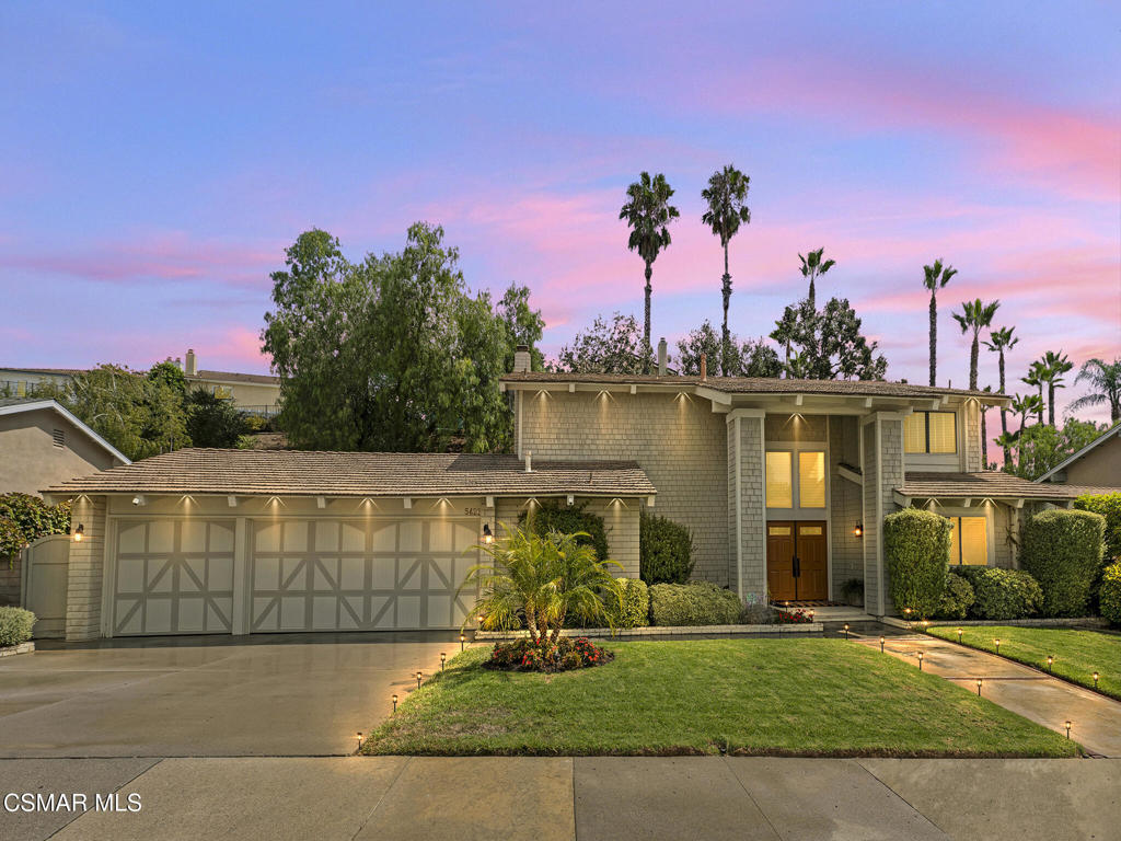 Modern Elegance on a Double Cul-de-Sac**Open and spacious, this 4BR + 3BA (2.5) residence is 2,328 sq ft of refined living on a private, lush 8,654 sq ft lot. A dramatic double-door entry opens to a soaring two-story foyer and striking catwalk, while wide-plank, wood-style porcelain tile unifies the main level with a warm, low-maintenance finish. Walls of tall, contemporary upgraded Pella windows and French sliders invite an abundance of natural light and frame verdant garden views, creating an effortless indoor-outdoor flow.Designed for gatherings, the mostly open layout moves with ease through formal and casual spaces. The remodeled dine-in kitchen pairs custom maple shaker cabinetry with extensive granite counters, an undermount sink, pantry wall with pull-out shelving, and stainless appliances--plus dual access points that enable a gracious circular traffic pattern for entertaining. Recessed lighting is thoughtfully placed throughout to complement, not compete with, the sunlit interiors.Beyond the staircase, a generous den/family room with custom built-ins and a white-brick gas fireplace offers flexible living--ideal for an office, media retreat, or potential main-level 5th bedroom (adjacent to the powder room; buyer to verify feasibility for adding a shower). A refined powder bath with granite finishes completes the first floor.Upstairs, the vaulted-ceiling primary suite is a serene retreat with recessed lighting, upgraded windows, and a walk-in closet featuring organizers and a discreet built-in ironing station. The spa-inspired bath showcases dual sinks set beneath mirrored medicine cabinets, glass-subway backsplash, granite surfaces, a spacious shower with seat and niche, and rich custom cabinetry. Three secondary bedrooms include organized closets and recessed lighting; an updated full bath serves the wing. An interior laundry room and attached 3-car garage with storage systems add everyday convenience.Outdoors, enjoy a private, low-maintenance oasis with fresh landscaping and hardscaping, an entertaining patio, and a fun putting green--plus ample room for herb/flower beds or a future spa. A custom covered dog run (accessible from the kitchen and yard) offers added peace of mind. Major 2024 upgrades include a new HVAC system, sprinkler system/landscaping, and water heater.Set within a beloved double cul-de-sac enclave, this residence is close to shopping, dining, recreation (golf, tennis, pickleball, gyms, trails), convenient freeway access, and the Las Virgenes Unified School District--plus coastal escapes in Malibu/Ventura are under 30 minutes. A meticulously maintained, move-in-ready gem with enduring style and value. **Welcome home.***Notes: Sq. ft., lot size, bed/bath count, school boundaries, and potential modifications to be verified by buyer.*
