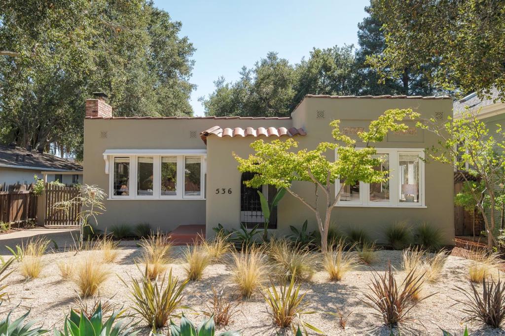 Enjoy this inviting Mediterranean-style home ideally situated in Palo Alto's Professorville neighborhood. The residence exudes timeless character with arched entryways, gleaming hardwood floors, original details, and abundant natural light throughout. The warm and welcoming living room features large picture windows and a classic brick fireplace, while the elegant formal dining room provides a perfect setting for gatherings. The kitchen overlooks the deep backyard and includes a casual dining area for relaxed everyday meals. A dedicated laundry room adds extra convenience. Outdoors, the home offers low-maintenance landscaping, a gated driveway leading to a detached one-car garage, and a spacious backyard with a covered patio ideal for easy living and entertaining. Just blocks from vibrant University Avenue, you'll enjoy convenient access to shopping, restaurants, Caltrain, Stanford University, top-rated Palo Alto schools, and Highway 101. A rare opportunity to live in one of Palo Alto's most desirable neighborhoods, this home combines enduring charm and a premier location.