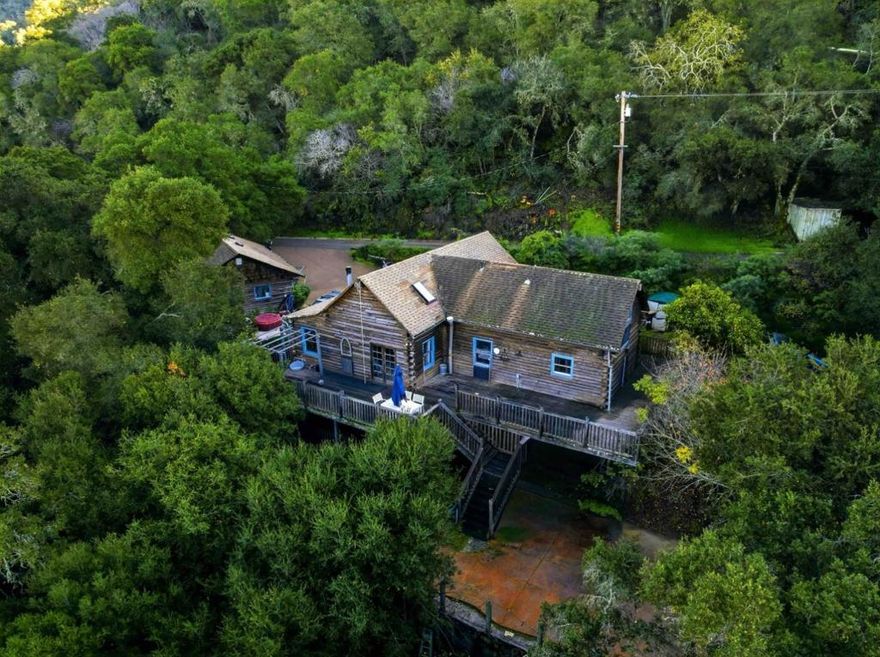 Escape to your own private retreat on 5 breathtaking acres just 25 minutes to Carmel and only 8 minutes to Hwy 156 and town. Tucked away in complete privacy, this 3-bedroom, 2-bath home is truly one-of-a-kind, offering the perfect blend of convenience, serenity, and character. Step inside and you're welcomed by warm, inviting living spaces that open out to a stunning back deck overlooking the canyon ideal spot for morning coffee, sunset wine, or starry-night gatherings. The expansive yard and patio were made for entertaining, with plenty of room for outdoor dining, games, and quiet relaxation, all framed by lush landscaping and mature trees. What sets this property apart is its incredible flexibility: an attached in-law quarters/ADU provides endless opportunities whether you need space for multi-generational living, a private guest suite, home office, caretaker unit, or potential rental income (buyer to verify use). If you've been searching for something that doesn't feel like every other house on the market this is it. Privacy, land, views, and a truly unique home you wont find anywhere else.