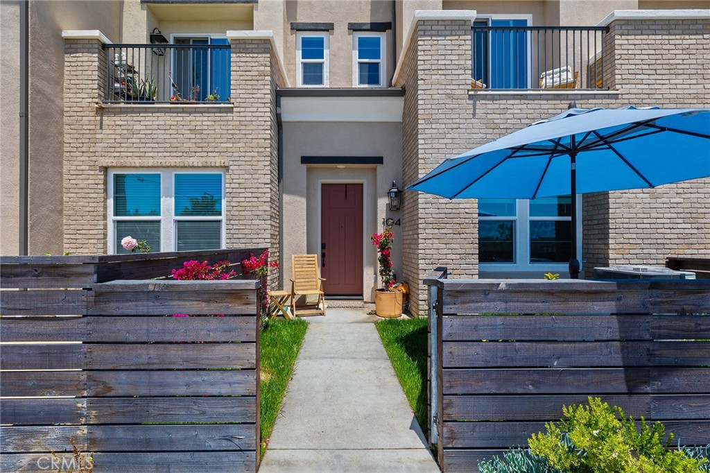 TURNKEY, Gorgeous 3 bedroom, 3 ¼ bath, 1858 square feet townhome located in the sought-after gated Sunrise View Community. This home boasts Italian stone flooring and upgraded carpets throughout. Beautiful natural light shines through windows that face lush mountain and hill views. An added bonus would be the colorful sunrise that greets you each and every morning. As you enter the ground floor, an ensuite bedroom and bath are upgraded to include custom designer paint. The kitchen is outfitted with stainless steel appliances, a large island and walk in pantry. Spacious laundry room located on the second floor. The primary bedroom/ensuite and third bedroom/ensuite are located on the third floor. High energy tankless water heater and car charging capabilities located in the 2 car garage, along with steel storage racks . This home has PAID SOLAR! The sparkling community pool and spa has a covered BBQ area with seating and surrounded by lush landscaping. Play areas are placed throughout the complex. Located near the 78 and 15 freeways off Barham and Myers, this home has it all and then some!