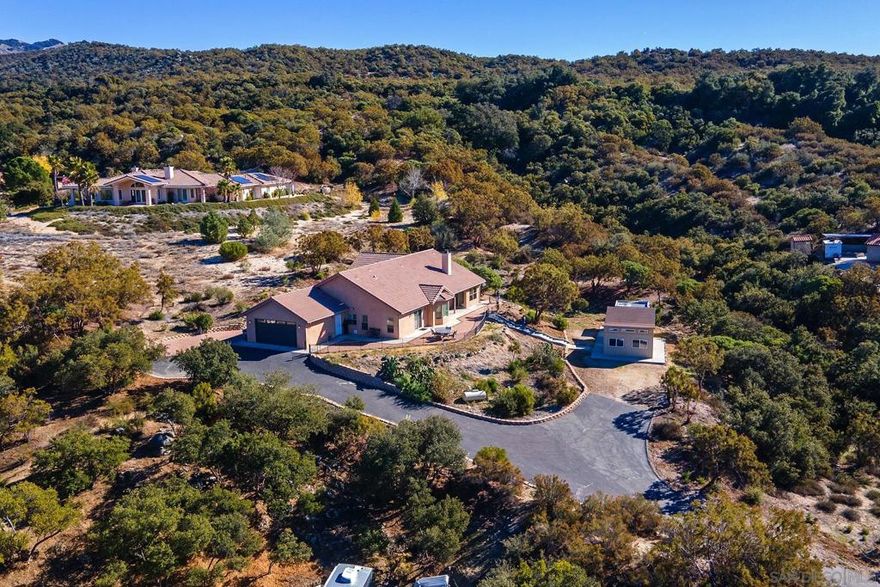 Freshly painted & move in ready! Perched on top of a hill with SPECTACULAR VIEWS of Hot Springs Mountain, Palomar Observatory, Sunshine Summit, Warner Springs Ranch Resort Golf Course & Cleveland National Forest sits this spacious 3 bed, 3 bath home on 1.74 acres offering a resort like feel & peaceful enjoyment! Great room with stone fireplace, formal dining room & kitchen w/lots of cabinets and counter space - Great for entertaining! All appliances included - double oven, refrigerator, dishwasher, microwave and washer/dryer. Bedroom closets have closet organizers and the spacious primary suite offers a relaxing soaking tub & separate shower as well as a sitting area that opens up to the view patio. Additional features include separate laundry room & an oversized 2-car garage with work bench & tons of cabinet storage. Shed available for additional storage. Tons of parking - room for all of your toys! Perfect for a full time residence or as a weekend retreat! Warner Springs is known for its mild 4 seasons, amazing sunrises & sunsets and bright starry skies. Ideally situated for day trips to the quaint mining town of Julian, Santa Ysabel, Palomar Observatory, Borrego Springs, San Diego & Temecula! Enjoy hiking along the Pacific Crest and California Riding & Hiking Trails or soar high in the sky with a local glider flight . Warner Springs is home to several boutique wineries offering weekend wine tasting along the North Mountain Wine Trail.