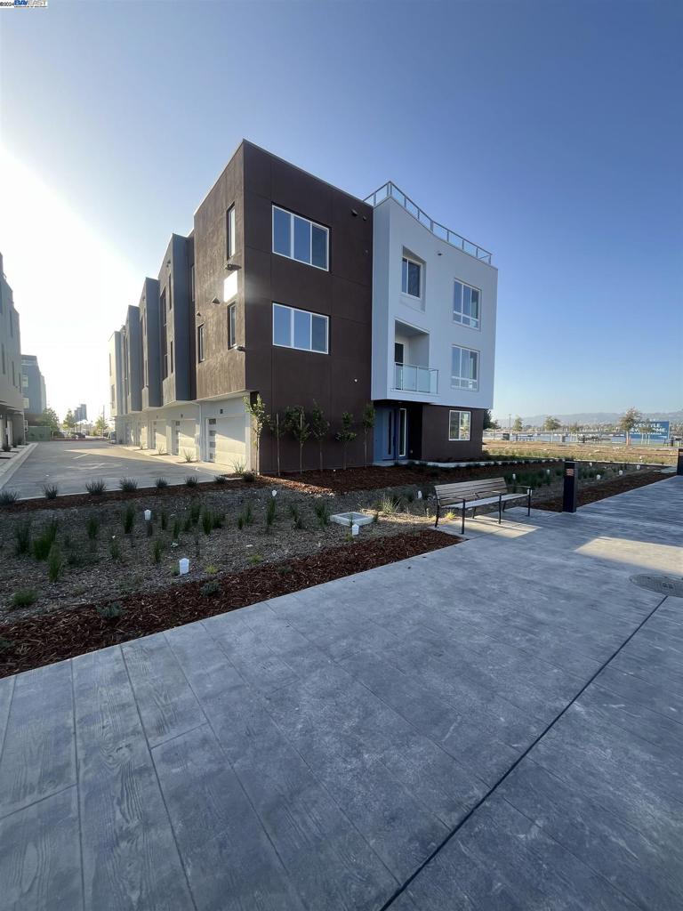Experience a refined yet inviting lifestyle at the townhomes of Alameda Marina, where elevated design meets the soothing embrace of waterfront living. Nestled along the picturesque channel linking Alameda to Oakland, Waterside at Alameda Marina seamlessly blends serene bayfront charm with vibrant Bay Area energy. These thoughtfully crafted townhomes provide unrivaled access to the region’s dynamic offerings, while their expansive rooftop decks serve as private retreats—perfect for unwinding, soaking in the fresh bay breeze, and savoring stunning views. Here, sophisticated comfort and coastal allure redefine the meaning of home.