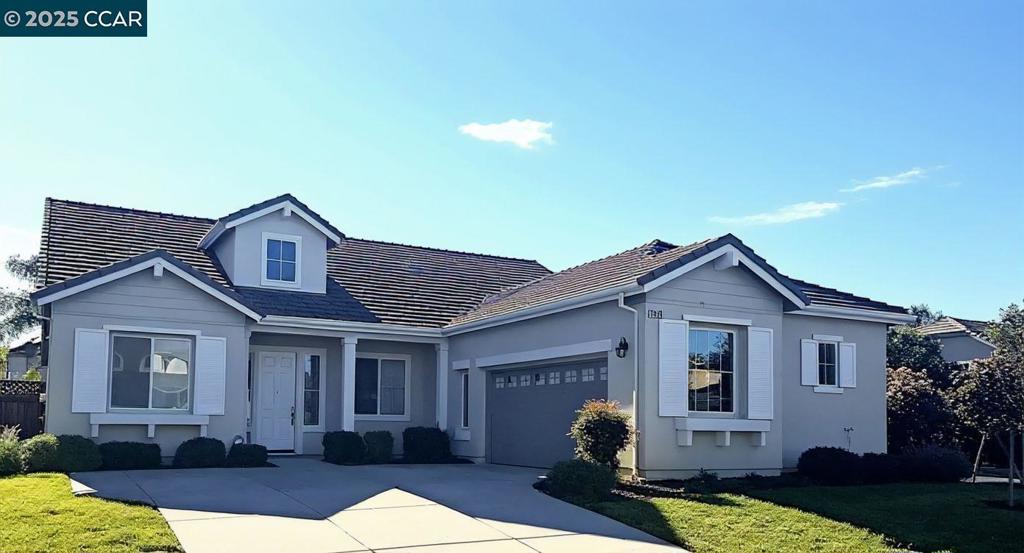 Beautiful single story home featuring 10 foot ceilings, 4 bedrooms, 2 bath with 2 car garage. A raised hearth and gas burning fireplace in family room. Kitchen has a breakfast nook, breakfast bar, island with veggie sink, tile floors and counters, community pool, spa, and clubhouse. A very elegant home that should not be missed. Envision your family in this spacious, bright and beautiful home. The front bonus room with ceiling fan can be an office, extra bedroom, exercise room, the possibilities are endless. The oversized main bedroom has a ceiling fan, walk in closet and attached bath with a soaker tub. The separate dining room with its warm and intimate light fixture is perfect for those special occasion meals with family and friends. Newer carpet throughout. Stone Patio is perfect for summer barbeques. Orange tree in yard.