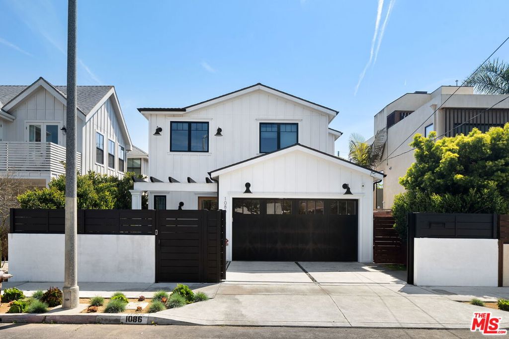 Fall in love with this stylish two-story modern farmhouse in the heart of Venice. Designed for quintessential California beach living, the open layout connects a spacious great room, gourmet kitchen, and expansive redwood deck through wall-to-wall folding glass doors seamlessly blending indoor and outdoor spaces. The chef's kitchen features a large island, custom cabinetry, Carrara marble counters, Thermador appliances, and a walk-in pantry. Upstairs, you will find three generous bedrooms, including a bright primary suite with a private balcony and a spa-like bath with Calacatta marble, dual vanity and a freestanding tub. A fourth bedroom is located downstairs, ideal for guests or a home office, along with a well-placed laundry room upstairs for added convenience. Outside, the tree-lined yard includes a sleek pool and hot tub perfect for entertaining. Don't miss this opportunity to live in the heart of Venice! *Please do not disturb occupants*
