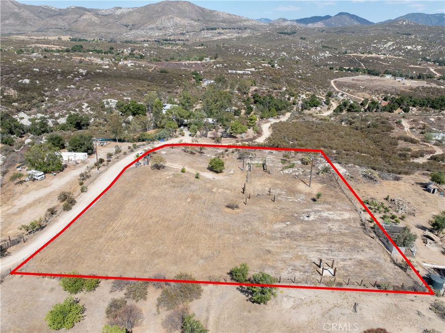 Comes equipped with a connected water well, connected electricity, and a conventional septic system in place. An exceptional opportunity awaits! These existing hookups drastically reduce development costs and timelines, allowing you or your future buyer to get started quickly on a custom build, a manufactured home, or a profitable investment property. 

This prime 2-acre, fully fenced lot in Hemet is perfect for both end-buyers seeking a private sanctuary and savvy investors looking for a high-potential project. With breathtaking panoramic mountain views, this land offers a rare blend of rural tranquility and lucrative possibility. What sets this property apart are the valuable utilities already in place. 

Zoned R-R (rural residential), the possibilities are endless. The lot's flat, usable topography is perfect for building a sprawling custom home, a manufactured home for rental income, or even a ranch with space for horses and agriculture. This flexibility opens the door to multiple development strategies—whether you plan to build and sell, build and rent, or create your own personal escape.

This isn't just a piece of land; it's a foundation for a profitable venture or a lifetime of memories. Don't miss out on this unique, market-ready property. Contact us today to unlock its full potential.

All information provided, including but not limited to lot size, square footage, dimensions, zoning, utility status, and permits, is deemed reliable but is not guaranteed. The buyer and/or their agent is responsible for independently verifying all information, and for conducting their own due diligence to their satisfaction. All potential uses of the property, including residential, agricultural, and equestrian, must be verified with the appropriate local government agencies.