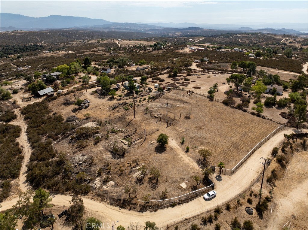 An exceptional opportunity awaits! This prime 2-acre, fully fenced lot in Hemet is perfect for both end-buyers seeking a private sanctuary and savvy investors looking for a high-potential project. With breathtaking panoramic mountain views, this land offers a rare blend of rural tranquility and lucrative possibility.
What sets this property apart are the valuable utilities already in place. Unlike most vacant land, this lot comes equipped with a connected water well, on-site electricity, and a conventional septic system. These existing hookups drastically reduce development costs and timelines, allowing you or your future buyer to get started quickly on a custom build, a manufactured home, or a profitable investment property.
Zoned R-R (rural residential), the possibilities are endless. The lot's flat, usable topography is perfect for building a sprawling custom home, a manufactured home for rental income, or even a ranch with space for horses and agriculture. This flexibility opens the door to multiple development strategies—whether you plan to build and sell, build and rent, or create your own personal escape.
This isn't just a piece of land; it's a foundation for a profitable venture or a lifetime of memories. Don't miss out on this unique, market-ready property. Contact us today to unlock its full potential.
All information provided, including but not limited to lot size, square footage, dimensions, zoning, utility status, and permits, is deemed reliable but is not guaranteed. The buyer and/or their agent is responsible for independently verifying all information, and for conducting their own due diligence to their satisfaction. All potential uses of the property, including residential, agricultural, and equestrian, must be verified with the appropriate local government agencies.
