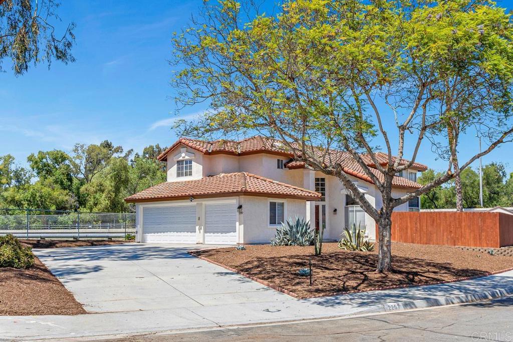 Bring all the toys, cars or RV to this spacious 4 bedroom home in great culdesac! Oversized driveway and 3 car garage offer ample storage and parking. No HOA fees! Fully fenced private back yard has garden/lawn area and large patio with pavers. Right across street from Reidy Creek golf course! No neighbors adjoining this lot. Small city greenbelt area and scenic Reidy Creek waterway adjacent. 5 minutes to freeway, shopping and you can even walk to several schools. Enjoy the good life in North Escondido!