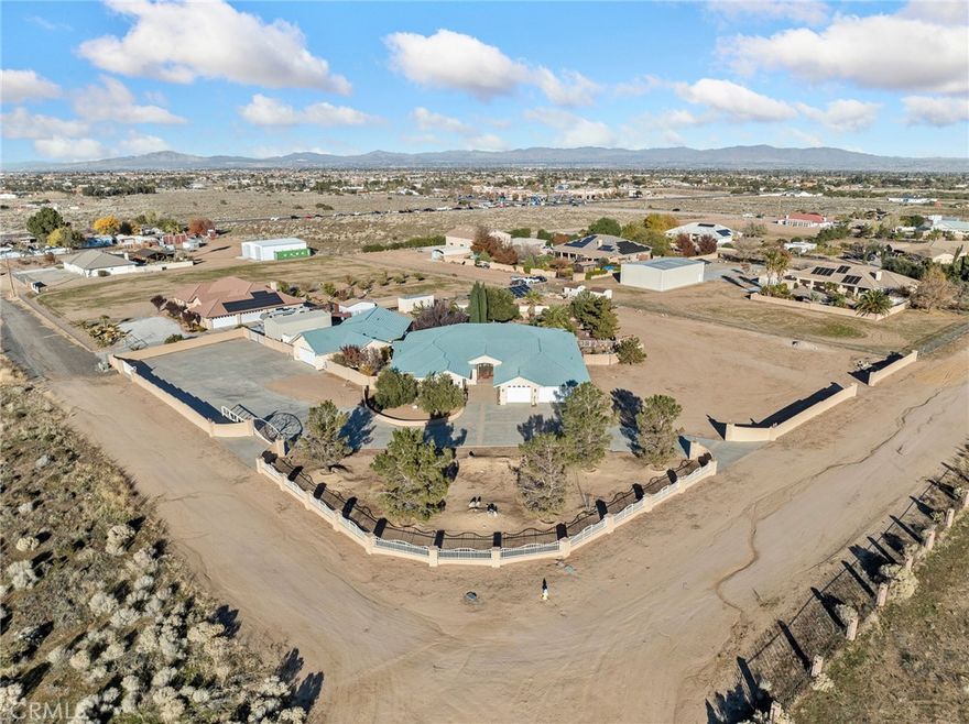 STUNNING CUSTOM HOME!!  Discover this amazing 3725 sq ft home on nearly 2 ACRES in the desirable OAK HILLS area - An exceptional blend of luxury, comfort and thoughtful design!  Step inside to a warm and inviting living space centered around a beautiful BRICK FIREPLACE, CUSTOM BUILT-IN ENTERTAINMENT CENTER, GORGEOUS TILE FLOORING and incredible windows bringing in natural light. HIGH CEILINGS and OPEN FLOOR PLAN create an inviting atmosphere - perfect for entertaining or simply enjoying family time.  The GOURMET KITCHEN is truly the heart of the home, featuring a MASSIVE CENTER ISLAND, GRANITE COUNTERTOPS, VIKING APPLIANCES, DOUBLE OVENS, WALK-IN PANTRY AND RICH HICKORY WOOD CABINETS.  
A really nice oversized laundry room with extra cabinets designed for ultimate convenience.  The Master suite is impressive with a fireplace, separate sitting room and large bathroom with separate vanities, LARGE SOAKING TUB, AWESOME WALK-IN SHOWER, AND SPACIOUS WALK-IN CLOSET  with built ins!  

      Relax in your an impressive park-like back yard!  Step into an entertainer's paradise complete with LARGE STUCCO COVERED BACK PATIO, OUTDOOR KITCHEN, CHARMING GAZEBO, palm trees, TRANQUIL KOI POND WITH WATERFALL AND COZY FIRE PIT - for nice gatherings or peaceful evenings at home.  Also a SECRET GARDEN area with water fountain and perennials!

        Adding to its appeal, the property boasts an AMAZING 1850 SQ FT WORKSHOP!!  Ideal for hobbyists, professionals or anyone in need of creating the ultimate home-based workspace.  This huge work shop also has its own bathroom and TWO separate automatic double garage doors.
EXTRA BONUS - COVERED RV PARKING (approximately 18x36)

          Every detail of this Oak Hills custom home has been crafted for beauty, function, and unforgettable living.
Come see this breathtaking home!