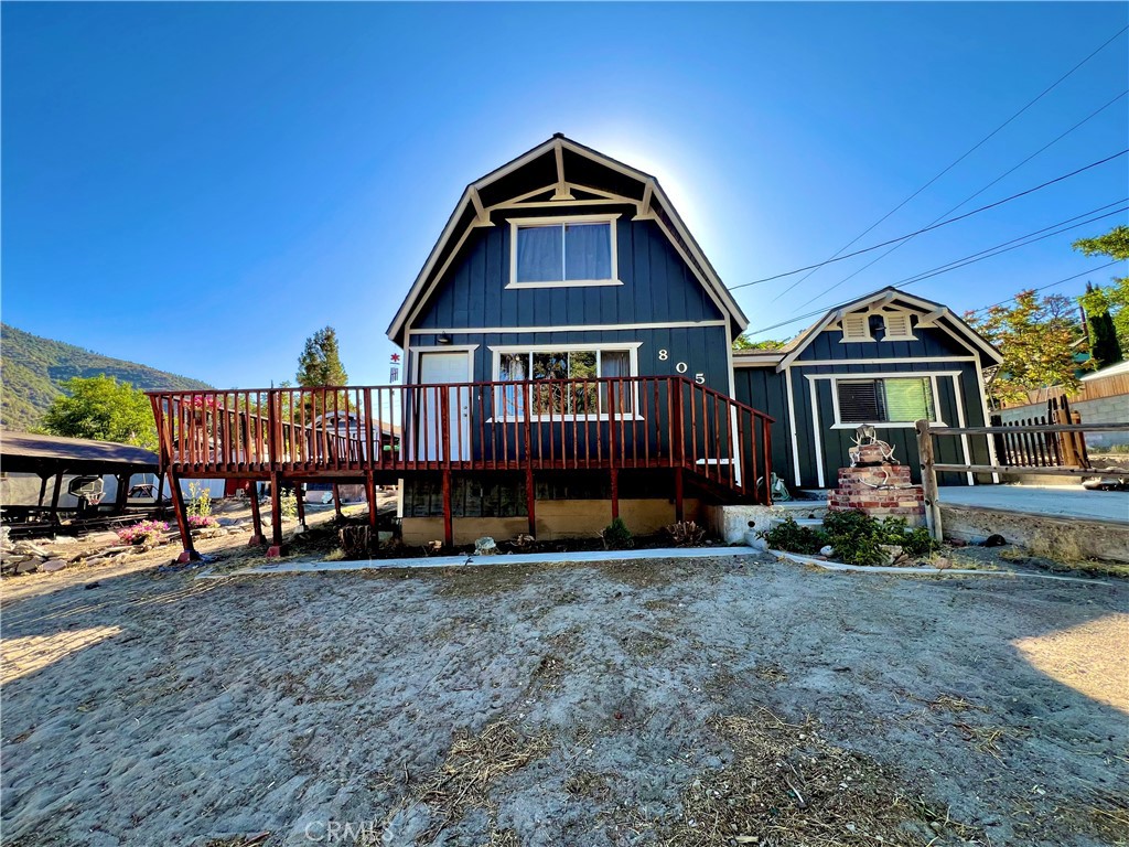 GREAT FAMILY HOME ON 2 COMBINED LOTS!! This 3 bedroom 2 bath home with freshly painted exterior and newer roof is centrally located on the "Sunny Side" of Frazier Park just off the paved road on a desirable oversized corner lot, within walking distance to restaurants and shops. The kitchen has new laminate flooring, lots of cabinets and a dining area with large windows to let in the sunlight and beautiful panoramic mountain views! Next to the kitchen is a bonus room for plenty of storage or extra living space with a piano that could be included in the sale. The inviting living room has a charming rustic knotty pine ceiling and new laminate flooring plus big windows. Just off the living room is the newly updated bathroom including an espresso colored vanity with white top, undermounted dual sinks, and a fogless touch screen dimmable mirror with ambiance lighting, 21" tall toilet and new flooring. Step down to the private primary bedroom with a high ceiling and His and Hers walk-in closets. Upstairs you'll find 2 freshly painted light and bright bedrooms with a Jack-n-Jill bathroom. Indoor laundry room with retractable stairs leading to attic storage space. The spacious yard offers an amazing new deck with solar lighting to sit and relax while taking in the spectacular views and starry nights! Plenty of room to BBQ and entertain with lots of sunny garden space including a cute shed for your tools. Covered RV parking, concrete driveway and a side yard that could provide more parking or play space. Located just 40 minutes to Santa Clarita or Bakersfield in a quaint mountain community where you can enjoy a slower paced lifestyle and four seasons of the lovely nature that surrounds you!