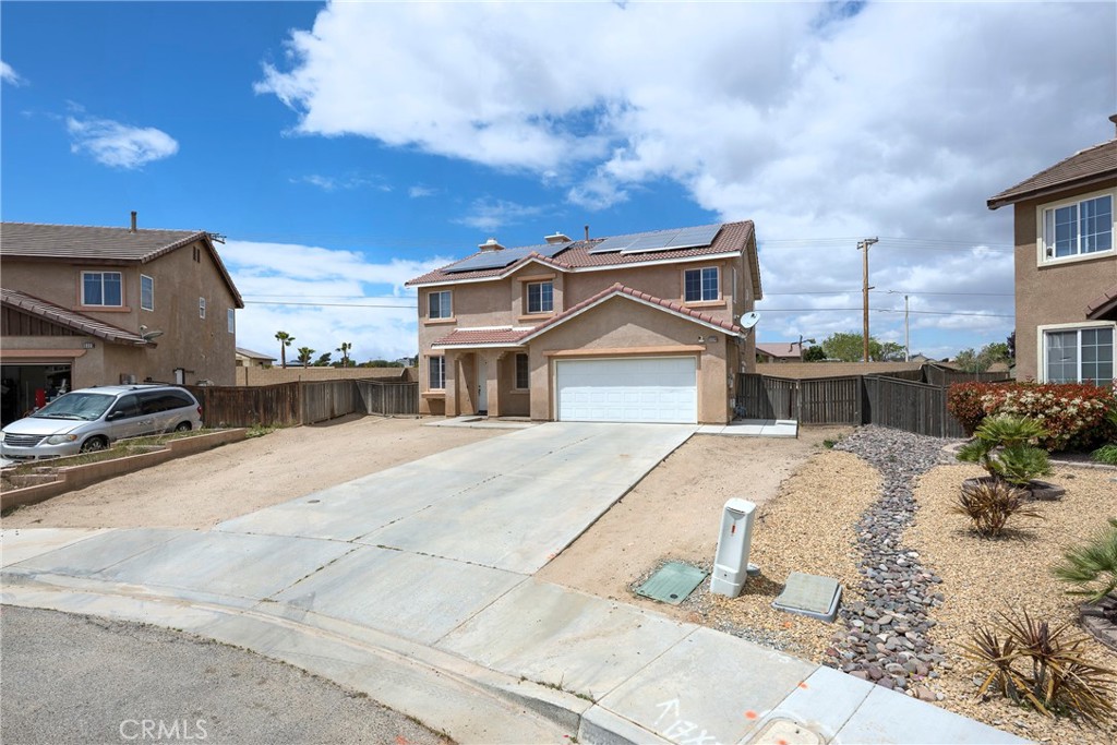 Welcome to this spacious two-story home nestled in the heart of Hesperia. Featuring 4 bedrooms and 2.5 bathrooms, this 2432 sq ft residence offers the perfect blend of comfort and functionality. Situated on a generous 9583 sq ft lot, there's plenty of room to entertain, garden, or even add a pool. This home features leased solar panels, enhancing energy efficiency and helping reduce monthly utility costs. In the backyard, enjoy a comfortable shaded area under the awning, perfect for outdoor gatherings. The space also includes a built-in grill and a mini fridge, both of which will convey with the sale, making it ideal for entertaining. Step inside to find an open floor plan with abundant natural light, a gorgeous living area, and a well-appointed kitchen - ideal for both everyday living and hosting guests.