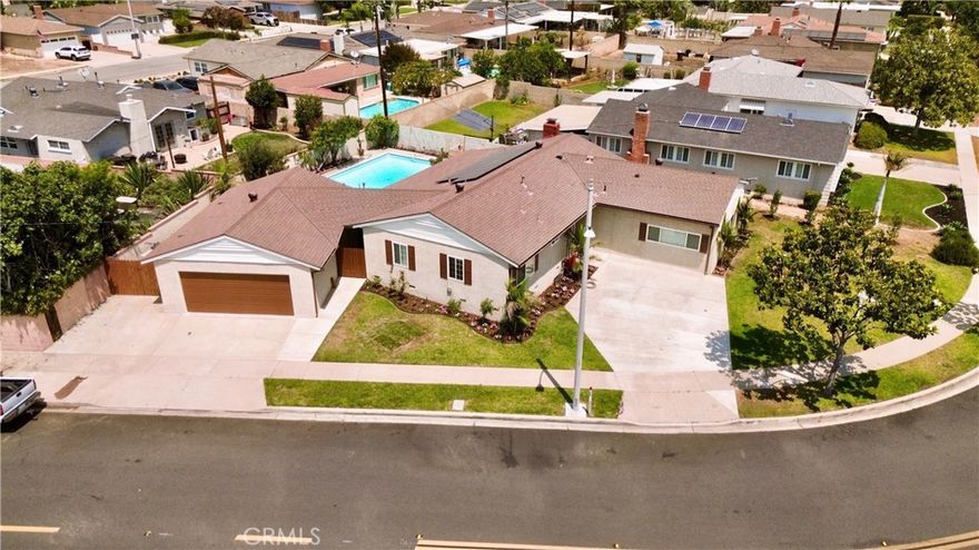Completely Remodeled Single-Story Pool Home in Brea! This stunning corner-lot residence offers 4 bedrooms, 3.5 bathrooms, and approximately 1,925 sq. ft. of modern living space—all fully renovated inside and out. Step inside to find new laminate wood flooring, fresh interior and exterior paint, recessed lighting throughout, and dual double-pane windows for energy efficiency. The beautifully remodeled kitchen features quartz countertops, custom cabinetry, a 6-burner stove with range hood, a breakfast bar, and a separate dining area accented by a custom shiplap ceiling. The home boasts two primary suites: Main Primary Suite—Fully permitted and privately located on the opposite side of the house, with a custom walk-in shower.

Second Primary Suite—Recessed lighting, built-in closet organizers, and a beautifully remodeled walk-in shower. Secondary bedrooms also feature recessed lighting, and the remodeled hallway bathroom offers a shower-over-tub design. Enjoy the private backyard oasis with a sparkling pool, brand-new water heater and equipment, and a custom-built equipment cover. The tropical landscaping, including mature palm trees, creates a relaxing atmosphere. The large covered patio is perfect for entertaining or quiet evenings. Additional features include PAID solar panels ($80,000-$100,000 value), entire house water filtration system ($10,000-$15,000 value), a detached two-car garage with laundry hookups, an outdoor bathroom for pool guests, and a spacious driveway for extra parking. Located in the heart of Brea—just minutes from downtown Birch Street and Brea Mall—with award-winning schools within walking distance. Don’t miss this move-in-ready beauty—schedule your private tour today!