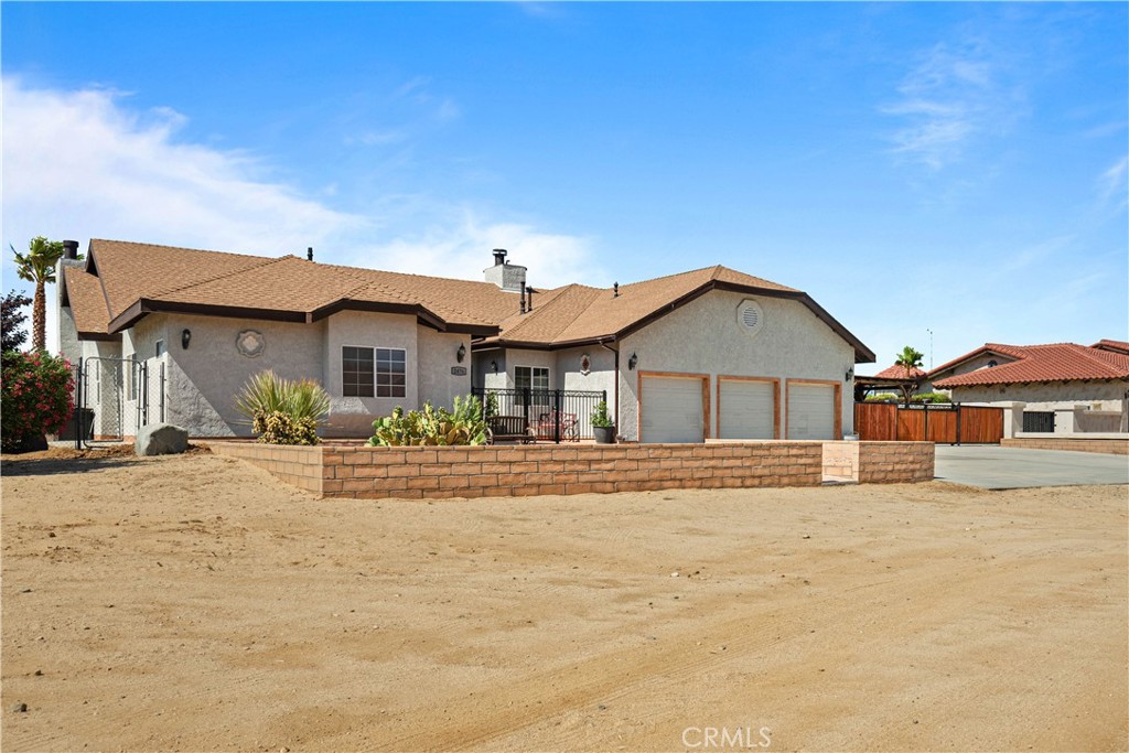 Professional Photography Coming Soon! Welcome to "Villa Sierras" A Serene Ranch Retreat on Over 2 Acres. "Villa Sierras" is a +/-2500 SQFT. three car garage ranch style home nestled in more than 2 acres of land with so much to offer. This beautiful three-bedroom three-bathroom home welcomes you with an inviting entrance that opens to the formal living area with a double-view fireplace and French style patio doors that showcases the breathtaking views. The panoramic views continue into the formal dining room, where a large picture window allows abundance of natural light. The kitchen features an island with a built-in stovetop and counter space perfect for meal preparation. In-kitchen dining options include a breakfast nook and a breakfast bar perfect for causal meals or morning coffee. A built-in dishwasher, oven and microwave are seamlessly integrated into the cabinetry. Additional highlights include a pantry with a stylish glass door, elegant glass-front cabinets, abundance of light and a patio door granting access to the back and side yard. The family room sets the perfect tone for movie night or entertaining guests. Designed with privacy in mind, the primary suite offers a tranquil sitting area with a cozy fireplace and direct access to the backyard. The spa-inspired en-suite bath offers a jetted jacuzzi tub, a separate walk-in shower, dual vanity sinks, and a spacious walk-in closet with custom built-in storage solutions. This home boasts a Jack-and-Jill bathroom shared between the secondary bedrooms, one of which features a walk-in closet. There is a laundry room with a custom-built-in office desk. This home offers closet space throughout for all your storage needs. Outdoor features include a covered patio perfect for relaxing or entertaining, a covered area with an above the ground pool, covered RV parking, and an oversized, versatile storage shed. Don’t miss the opportunity to make this beautiful gem your own. Schedule your private showing today!