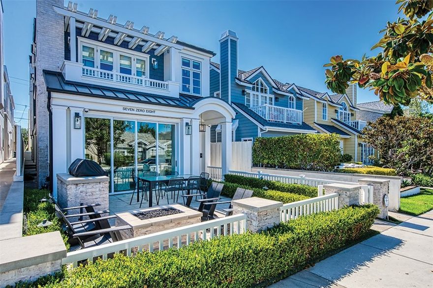 Discover an unparalleled opportunity to own a stunning, turn-key residence in the heart of the coveted Corona del Mar Village. 708 Heliotrope Avenue is a gorgeous front unit townhome that embodies modern luxury and effortless California living, all on one of the most sought-after streets.

This impeccable home, built by the renowned Patterson Builders and meticulously maintained by their dedicated crew, presents a condition that is truly "like new," complete with a pristine, freshly painted exterior. Venture inside to be greeted by a large, open-concept layout flooded with natural light, where wide-plank white oak floors flow throughout. The beautiful, intuitive floor plan is perfect for both entertaining and everyday living, featuring exquisite custom wood cabinets and elegant nickel-plated banisters that underscore the home's sophisticated aesthetic.

The gourmet kitchen is a chef's dream, outfitted with top-tier Thermador appliances, including a six-burner gas range. Sleek Neolith countertops provide ample space for preparation, while designer Kate Spade and Restoration Hardware chandeliers and fixtures add a touch of glamour and refined style.

The indoor-outdoor connection is seamless, thanks to magnificent LaCantina doors that open to reveal your beautiful front patio which features a custom fire pit and a built-in Sedona outdoor grill, creating an ideal setting for al fresco dining and relaxation. Ascend to your own rooftop deck and be captivated by views of Catalina Island—the perfect backdrop for sunset cocktails and hosting guests.

This home is a technological marvel, offering a fully integrated smart home system controlled with ease. The comprehensive package includes smart lighting, automatic shades, a full security system with cameras, a multi-room surround sound system with speakers on the patio and rooftop deck, and a central alarm system.You are just moments away from world-class dining, boutique shopping, pristine beaches, and award-winning schools. This is more than a home; it's a lifestyle.