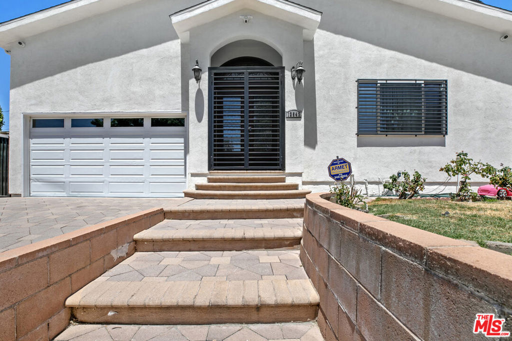 Step into luxury living in one of Valley Glen's most sought-after neighborhoods. This beautifully maintained home offers a combined ~3,800 sq ft of sophisticated living space, which includes an impressive ~1,200 sq ft upstairs bonus room blending elegance, comfort, and functionality for the modern lifestyle. Enter through grand double doors into a light-filled living room featuring a custom coffered ceiling, fireplace, wet bar, and recessed lighting. The chef's kitchen is fully equipped with Caesarstone countertops, full backsplash, high-end stainless steel appliances, center island, and extensive custom cabinetry.A separate family room with trey ceilings opens directly to a spacious, covered patio perfect for indoor-outdoor entertaining. All three bedrooms offer en-suite bathrooms for maximum privacy and convenience. The expansive primary suite includes trey ceilings, backyard access, a generous walk-in closet, and a spa-inspired bathroom with a jetted tub, glass-enclosed shower, and dual vanities. The home also features a dedicated office and a separate laundry room ideal for work-from-home flexibility and everyday convenience. Upstairs, discover a versatile bonus room with vaulted ceilings, skylight, custom lighting, powder room, and substantial storage. Whether used as a gym, studio, guest suite, or media lounge, this space adds tremendous value and utility. The upgraded backyard features brand new tile and pavers, providing a clean, low-maintenance outdoor retreat. Additional highlights include an attached 2-car garage with epoxy flooring, gated driveway, and the option for partial furnishings. A rare leasing opportunity that combines space, style, and exceptional quality available for move-in September 1.