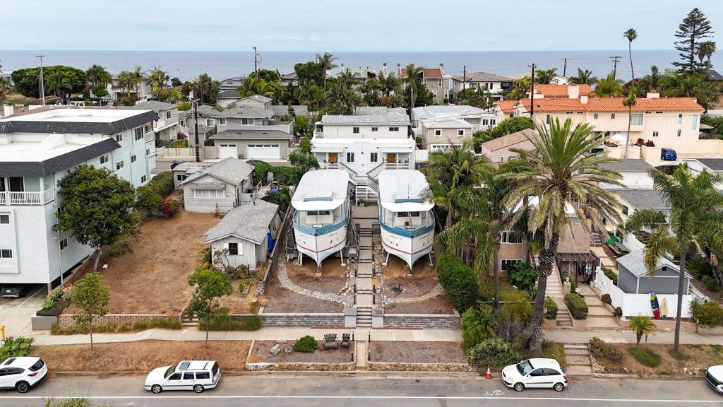 Charming Historical Boathouse for Rent – S.S. Encinitas, built in the late 1920s by architect Miles Kellogg. Crafted with reclaimed materials from the old Moonlight Beach dance studio and inspired by the charm of Historic Highway 101. This two-story 2-bedroom + office / 1.5-bath historical boathouse offers a one-of-a-kind living experience just blocks from the beach. The main level has one bedroom and full bathroom. Upstairs features the primary bedroom with an optional room/office. Private deck overlooking Downtown Encinitas. Kitchen equipped with a gas stove and refrigerator,. Access on-site community laundry. Walk to the beach, Coaster Station, shops & restaurants. Street parking. Live steps from everything Encinitas has to offer in this iconic, rarely available historic residence.