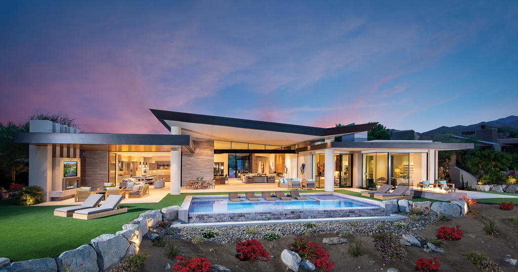Completed in 2019, this contemporary home features a large great room with pocket sliders that lead to the entertainment patio, pool/spa and outdoor fireplace and TV. The gourmet kitchen features high end appliances with a separate catering kitchen.