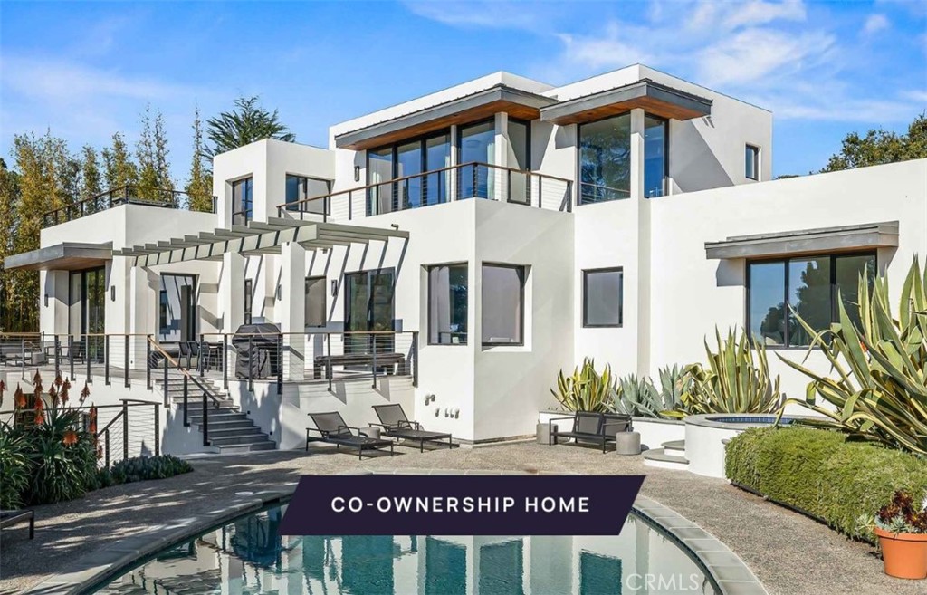 New co-ownership opportunity: Own one-eighth of this professionally managed, turnkey home by Pacaso. This contemporary showcase offers superb vistas, spacious rooms, and seamless flow to terraces and gardens. With ocean views below and mountains above, this 4-bedroom, 5-bathroom retreat is unparalleled. The open-concept great room features a sleek kitchen, dining area, and lounge, opening to a Pacific-view terrace near the pool or a walled garden. A striking wood, steel, and glass staircase connects the levels. The main-level primary suite offers a zen-like en suite and pool terrace access. A rooftop wet bar complements the secondary suite. Additional features include a fourth bedroom with a garden terrace and luxurious furnishings throughout.