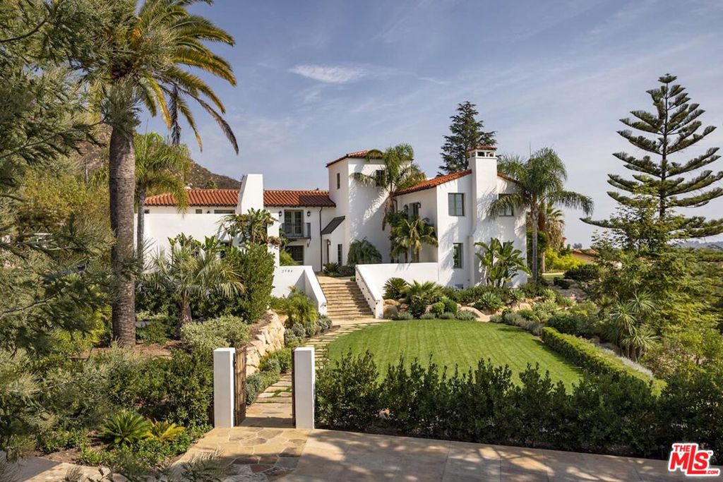 A stunning example of what it means to live the ultimate Montecito lifestyle, this breathtaking ocean view retreat boasts unfiltered luxury at every turn, an ambiance of relaxed sophistication and seamless indoor/outdoor living. State of the art renovations and impeccable design complement the incredible panoramic ocean, island and mountain views to create the ultimate dream home. Embraced by a serene natural setting and utmost privacy, yet located moments from all Montecito has to offer, it truly doesn't get much better than this. The compound-like Spanish Colonial-style estate features a stunning 5 bd, 7 ba main residence, a detached 1 bd, 1 bth guest house, and an extensive list of indoor and outdoor amenities, making this the perfect place to entertain - just in time for the holidays! No expense was spared during the custom remodel with premium finishes throughout, including French white oak floors and customized marble, wood beam ceilings and refined archways. Wake up to dreamy ocean views in the lavish primary suite, replete with a private ocean view patio, impressive en-suite bath, versatile bonus room and large walk-in closet. The gourmet kitchen is fitted with top of the line appliances, abundant custom cabinetry, a generous island with counter seating, and custom steel bi-fold and french doors to the resort-like grounds. Equally as impressive as the interior, the approx. 3.48-acre grounds host a spacious patio off the main living spaces where a custom fireplace with cozy seating, outdoor kitchen, and al fresco dining neighbor the awe-inspiring infinity pool and spa. Meandering pathways guide one through the vibrant orchard to the sport court and nearby emerald lawn. In addition, the property also hosts a private well, back-up generator, 2 2-car garages, and a convenient outdoor shower. The best of both worlds, this immaculate estate offers utmost privacy, convenience and surreal natural beauty, yet is located moments from Montecito's Upper Village, renowned hiking trails, world-class beaches and more.