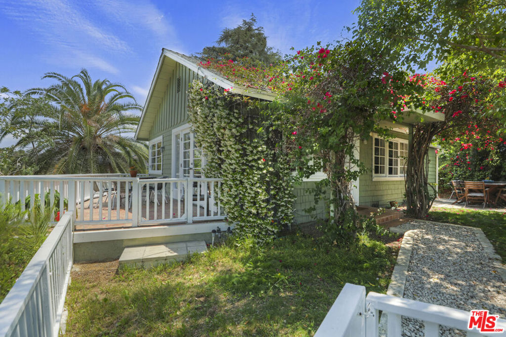 This charming remodeled bungalow in prime Echo Park is available for lease. Perched above the street, the 1946 vintage home invokes the feeling of a treehouse, showered in sunshine and gorgeous vistas. Wood flooring flows throughout and French doors bring the outdoors inside. The stylish open kitchen presents a mosaic tile backsplash, floating shelves and a stainless appliance suite with Viking range. Two bright bedrooms include the Primary with an attached bath and walk-in closet; the ground-level bonus room has a private entrance, perfect for your office, studio or guest space. Lush open-air patio and terrace areas invite you to relax, dine and entertain within a leafy, tranquil oasis. Tucked away from the city you are near everything great about Echo Park including Valerie, Cookbook, Canyon Coffee, Quarter Sheets, the weekly farmer's market and more. Elysian Park hiking trails are right up the street and the commute is easy to Silver Lake, Hollywood, Glendale, Burbank, and Downtown LA.