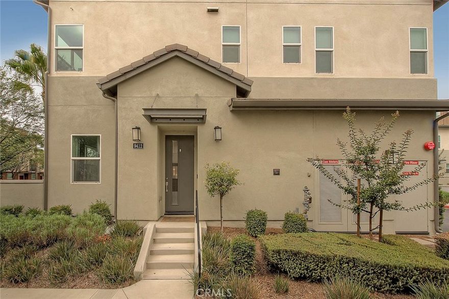 Welcome to 9412 Shade Place, a stylish 2020-built, end unit condo in the highly desirable master-planned community of The Resort in Rancho Cucamonga. With approximately 1,955 sq. ft. of modern living space, this home features 4 spacious bedrooms, 2.5 bathrooms, and a versatile third-story loft that can easily serve as a bonus room, media space, or home office. Step inside to an open-concept floor plan where natural light flows through the living and dining areas. The gourmet kitchen offers a clean, timeless look with crisp white cabinetry, quartz countertops, stainless steel appliances, and a custom backsplash—designed for both function and style. The seamless flow makes it perfect for everyday living and hosting gatherings. Upstairs, the primary suite is a private retreat with a walk-in closet, dual vanities, and a glass-enclosed shower. Additional two bedrooms are roomy and adaptable, while a convenient upstairs laundry room simplifies daily routines. Modern energy-efficient features include a tankless water heater and a whole-house fan—ideal for cooling the home without always relying on the A/C. The 2-car garage is finished with epoxy flooring, ceiling-mounted storage racks, and extra built-in storage space. Living at The Resort means access to incredible amenities: The Club on 6th features a resort-style pool and spa, fitness center with yoga room, conference spaces, event rooms, complimentary coffee bar, kids’ playroom, fire pits, BBQ grills, and even a dog wash station. Multiple dog parks and monthly community events, like the local farmers market, create a vibrant neighborhood atmosphere. The location is unmatched—just steps from Toyota Arena, minutes to TopGolf, Ontario Mills, Victoria Gardens, and endless shopping and dining options. Commuters will appreciate quick access to major freeways, the Rancho Cucamonga Metrolink, and Ontario International Airport. Combining modern finishes, energy-efficient design, and resort-style amenities, 9412 Shade Place is more than just a home—it’s a lifestyle.