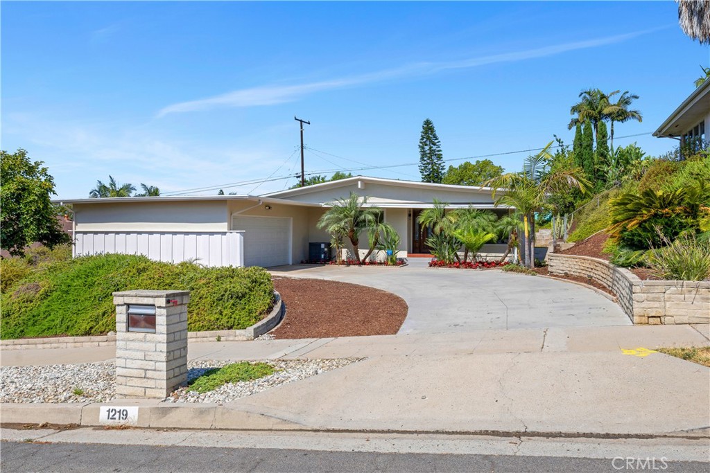 Enter Timeless Sophistication With This Beautifully Updated 4-Bedroom, 3-Bath Mid-Century Modern Gem, Nestled On A Spacious Lot With Lush, Professionally Landscaped Grounds. Bathed In Natural Light, This Home Boasts New, Large Windows That Seamlessly Blend Indoor And Outdoor Living. Inside, You'll Find Brand-New Designer Flooring, Custom Interior And Exterior Paint, And A Stunning New Kitchen Featuring Custom Cabinetry,Premium Finishes, And Modern Appliances—Perfect For Entertaining Or Everyday Living. Each Bathroom Has Been Custom-Designed With High-End Materials And Thoughtful Details, Offering A Spa-Like Retreat. The Layout Is Enhanced By New Lighting Throughout, Including A Statement Custom Chandelier That Adds A Touch Of Glamour. With Four Spacious Bedrooms, Including A Luxurious Primary Suite, There’s Room For Everyone To Live, Work, And Relax In Style. Outside, The Expansive Yard Offers Endless Possibilities—Whether You're Hosting Gatherings, Gardening, Or Simply Enjoying The California Sunshine. Located Just Minutes From Cal State Fullerton, Troy High School, And A Variety Of Shopping And Dining Destinations, This Home Offers The Perfect Blend Of Style, Comfort, And Convenience. This Is A Rare Opportunity To Own A Home That Combines Mid-Century Charm With Modern Luxury—Move-In Ready.