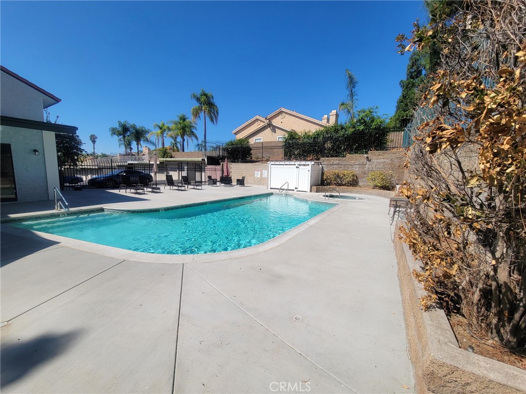 Beautiful 2-bedroom, 2-bath condo featuring tile and wood flooring throughout. Enjoy a spacious living area with cozy fireplace, 2 bathrooms updated with new vanities, and a primary suite with private bath. Kitchen is equipped with new stainless steel microwave and oven, plus convenient in-unit washer and dryer. Includes 1-car garage and permitted parking. Prime location near Brea Mall, shopping, dining, and easy freeway access.
