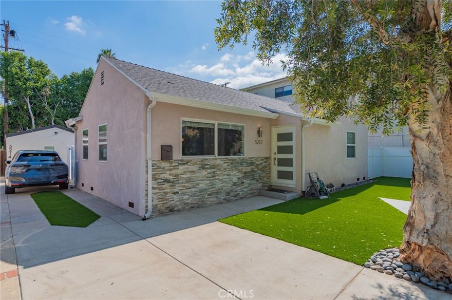 Welcome to this beautifully renovated 3-Bedroom, 2-Bathroom home nestled in a highly desirable pocket of Sherman Oaks. Thoughtfully redesigned with sleek, contemporary finishes throughout, this home offers the perfect blend of style, comfort, and functionality. Step into a bright and airy open floor plan featuring a spacious living room and dining area open to the Kitchen, ideal for entertaining family and friends. The chef-inspired kitchen boasts quartz countertops, a striking stainless steel mosaic backsplash, a farmhouse sink, LED recessed lighting, and stainless steel appliances. Kitchen inclues Refrigerator. The generous primary suite is a true retreat, complete with a large walk-in closet and a luxurious en-suite bathroom featuring a modern dual-sink vanity with white quartz counters and a frameless glass shower. Central AC & Heat. Enjoy the newly installed Turf in the Front and Backyard which saves money on the water bill. Great location close to 2 area malls, shopping and restaurants, with easy access to the 405 & 101 Freeways & a short drive to West L.A. Ready to move-in!
