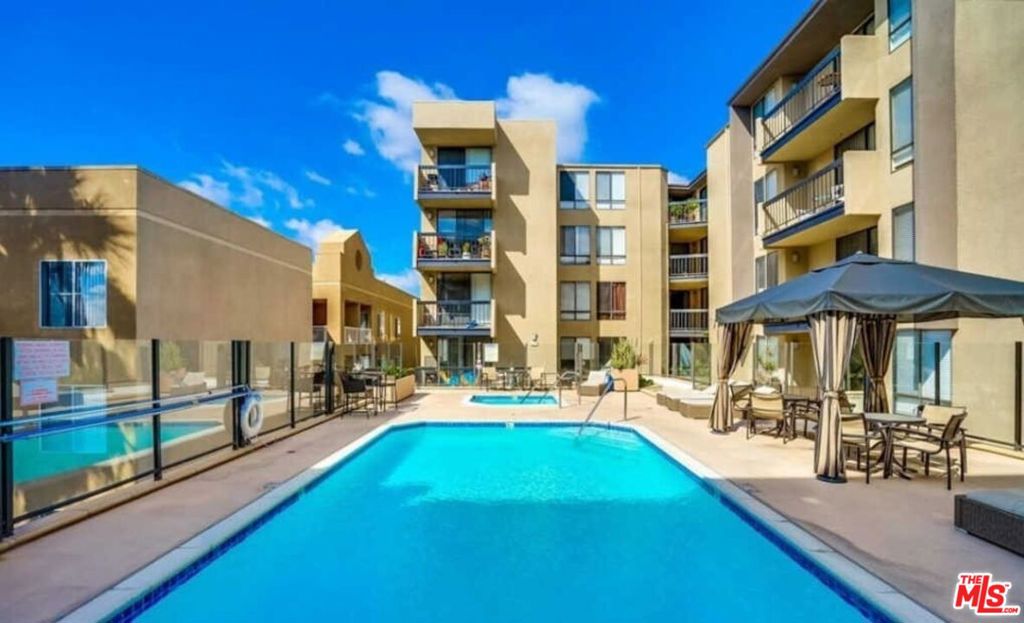Location location location! RESORT STYLE EASY LIVING HOLLYWOOD STYLE... with a sparkling pool, cabanas and fitness center. Why rent when you can buy? This bright and light contemporary condo is nestled at the base of Hollywood Hills, Enjoy views, views, views! . This fabulous one bed is the perfect place to call your first home in Los Angeles or a city pied a terre? Enjoy everything Los Angeles lifestyle. Close proximity to the Studios , a short stroll to the famous Hollywood walk of Fame, and the location of the Academy awards! Enjoy this fabulous unit with Large windows throughout offering amazing views over the LA city skyline and tons of natural light. Take in the city lights while enjoying your privacy. Renovated with beautiful finishes, the kitchen is fully equipped with stainless steel appliances and a gas stove top, microwave and dishwasher. Large bedroom also with fabulous views and tons of light has built in closets and an in unit stackable separate washer and dryer. Upgraded bathroom with a separate vanity area and several closets. Large living area, with a charming gas fireplace. One block off Sunset Blvd, this unit is minutes from Runyon Canyon hiking trails, incredible LA restaurants, and famed Hollywood nightlife! HVAC System, central air conditioning. Tiled floors throughout your living and primary suite. And Includes two parking spots in secure garage and guest parking. Guard duty at night. Clean, modern amenities, fabulous pool, cabana area, hot tub, well-equipped fitness center - A well-maintained building. Move in & enjoy resort style living and the rest of summer. And make this clean palette your own This is a must see!