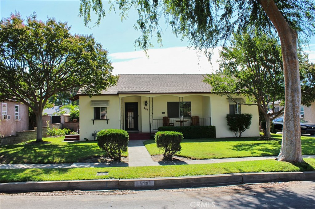 This delightful 3-bedroom, 1 bathroom home is located in the desirable city of Upland on a gorgeous treelined street. Built in 1950, this charming residence offers 1,174 square feet of comfortable living space. The cozy breakfast nook and kitchen are connected to the formal dining room which makes it perfect for those wonderful family gatherings during the holidays. There are plenty of windows that allow natural light in. The huge window in the living room has a great view of the well cared for flower garden in the back yard. Imagine yourself drinking your morning coffee in the serenity of the peaceful front porch. The BBQ area in the back yard's covered patio is also very inviting for family gatherings. This house has a fresh coat of paint and hardwood floors under the carpet in all the three bedrooms and living room waiting to be discovered! This home is nestled in between the 10 and the 210 freeways allowing easy access to the 15, 215, and 605 freeways. It is within walking distance to San Antonio Regional Hospital, YMCA, Pacific Electric rail, Upland Memorial Skate Park and baseball field, Metrolink Train Station, and plenty of restaurants. It is also located within a few minutes' drive of historic Downtown Upland, Colonies shopping center, and Red Hills Country Club. If you are thinking of an investment property, this is it! There is the possibility for an ADU in the convenient detached three-car garage which also provides ample parking and storage options. This home is perfectly priced to sell. Don't miss the opportunity to own a piece of Upland history!