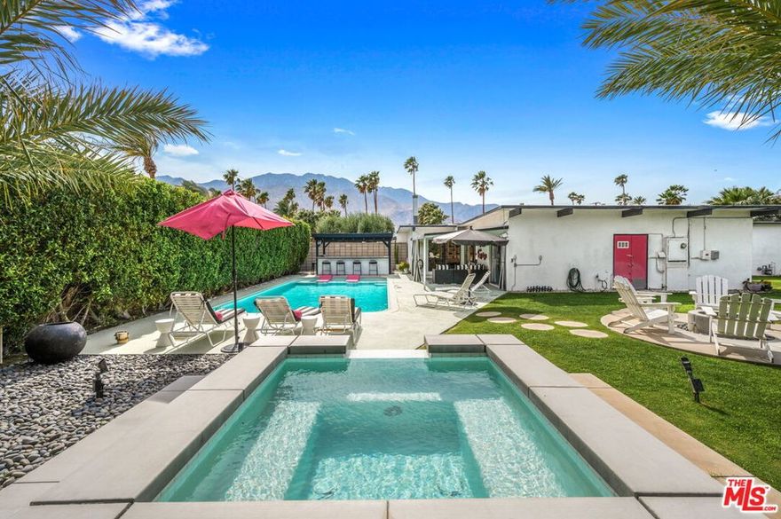 Available for lease starting October 20. FULLY FURNISHED MEISELMAN - a piece of Palm Springs history. This indoor/outdoor retreat comes complete with a custom bar for sunset cocktails, a sophisticated outdoor living room, a cozy firepit surrounded by Adirondack chairs and an expansive yard for the kids or pups to run themselves ragged. Oh - and don't forget the oversized pool and hot tub for year-round entertaining! When you just can't take any more of the breathtaking sunsets or panoramic mountain views, retire to the chic interior. With its vibrant colors and stylish mid-century wallpaper, every room pops with personality. It's a blend of classic Palm Springs flair and modern comfort. Home has an electric car charger in garage. Landlord pays all utilities except gas & cable/internet.