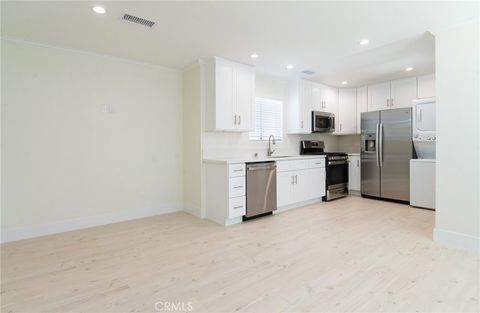 Photo of 11831 Pomering RD #B, Downey, CA 90241 (MLS # DW26137398)