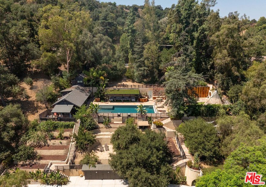 An extraordinary sanctuary where Hollywood history and creative living converge. This singular compound, dating back to 1925, offers a rare chance to own a true piece of Los Angeles legend. Nestled in Laurel Canyon's most coveted enclave; Fryman Canyon,  the estate combines old Hollywood glamour with contemporary sophistication. With no neighbors on two sides, direct park access, and a private parking lot for 12+ cars, it feels like your own secluded retreat in the woods - serene, expansive, with sweeping canyon and valley views that feel worlds away from Los Angeles. A Legacy Written in Time; Originally a clandestine speakeasy for Hollywood's vaudeville elite, the estate later became the cherished home of Johnny Weissmuller, the original Tarzan. Elizabeth Taylor and Shirley Temple learned to swim here. Today, the property has been meticulously reimagined, preserving its cinematic past while embracing modern artistry and comfort. Multiple Distinctive Residences, the hillside compound comprises several uniquely named structures, each with its own character: At the heart of the estate stands an authentic teepee, a symbol of its enduring spirit of storytelling and connection. Inspired Grounds; The property's lush acreage includes a pool, spa, infrared sauna - 2 performance venues; an amphitheater, and hilltop performance deck. Expansive entertaining areas feature a wet bar, cabana, kitchen, and indoor-outdoor showers and baths - ideal for both private retreats and large-scale gatherings. A Private World of Possibility. This is more than a residence; it's a canvas for the extraordinary. Artists, musicians, entrepreneurs, or visionaries will find limitless opportunity in this legendary Fryman Canyon estate, a secluded world just minutes from the heart of the city.